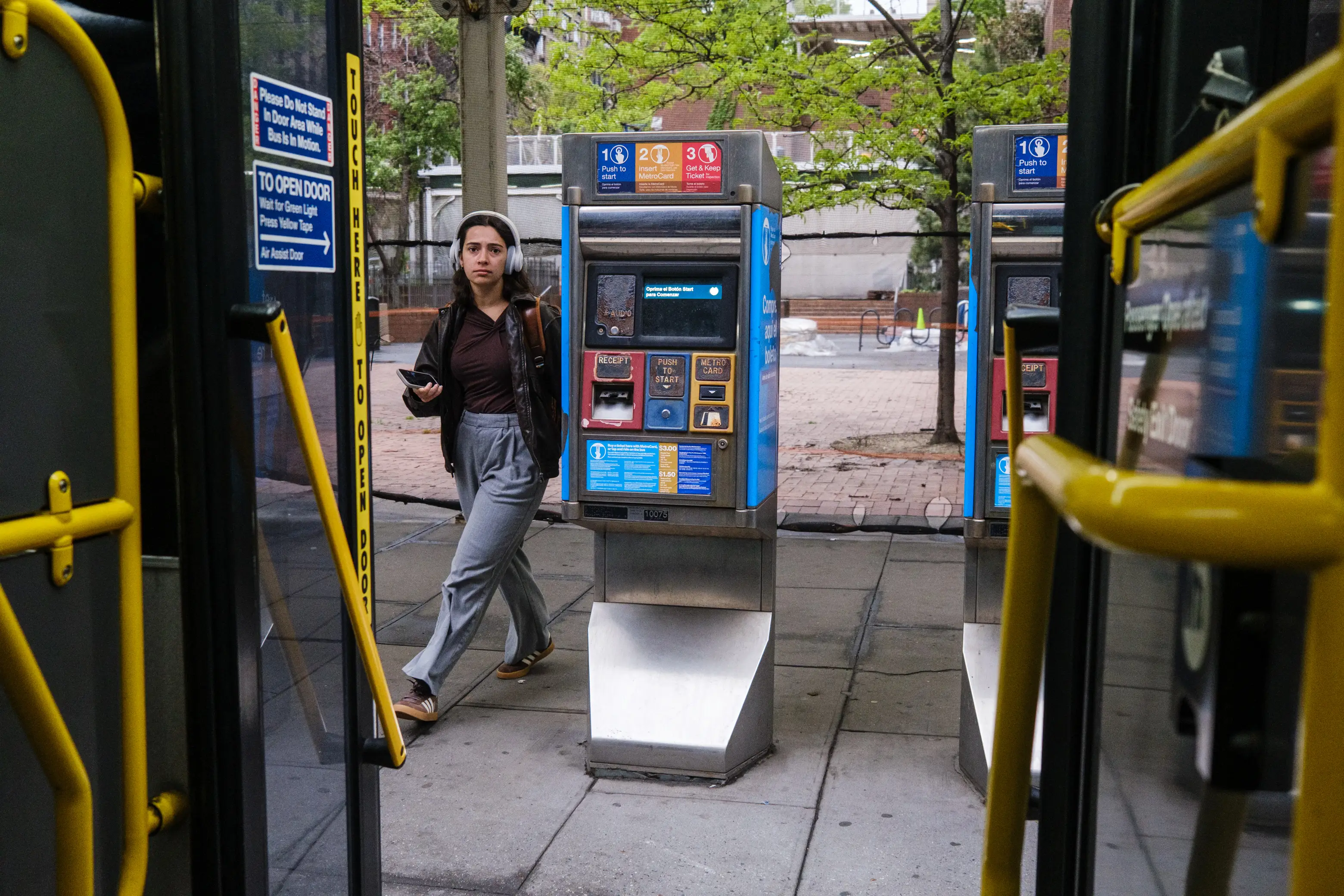 A woman boarding the M15 bus
