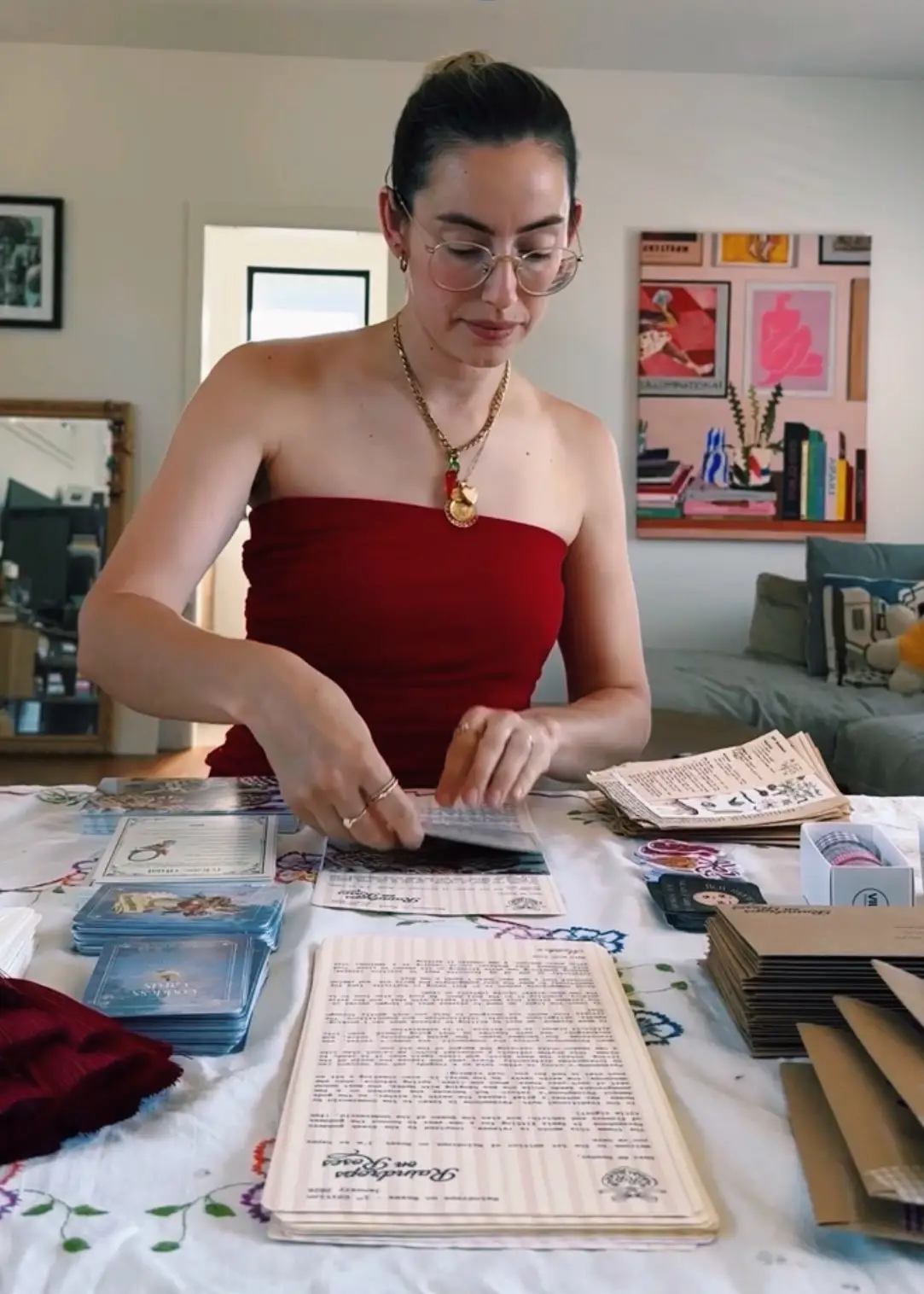 A woman packing letters into envelopes.