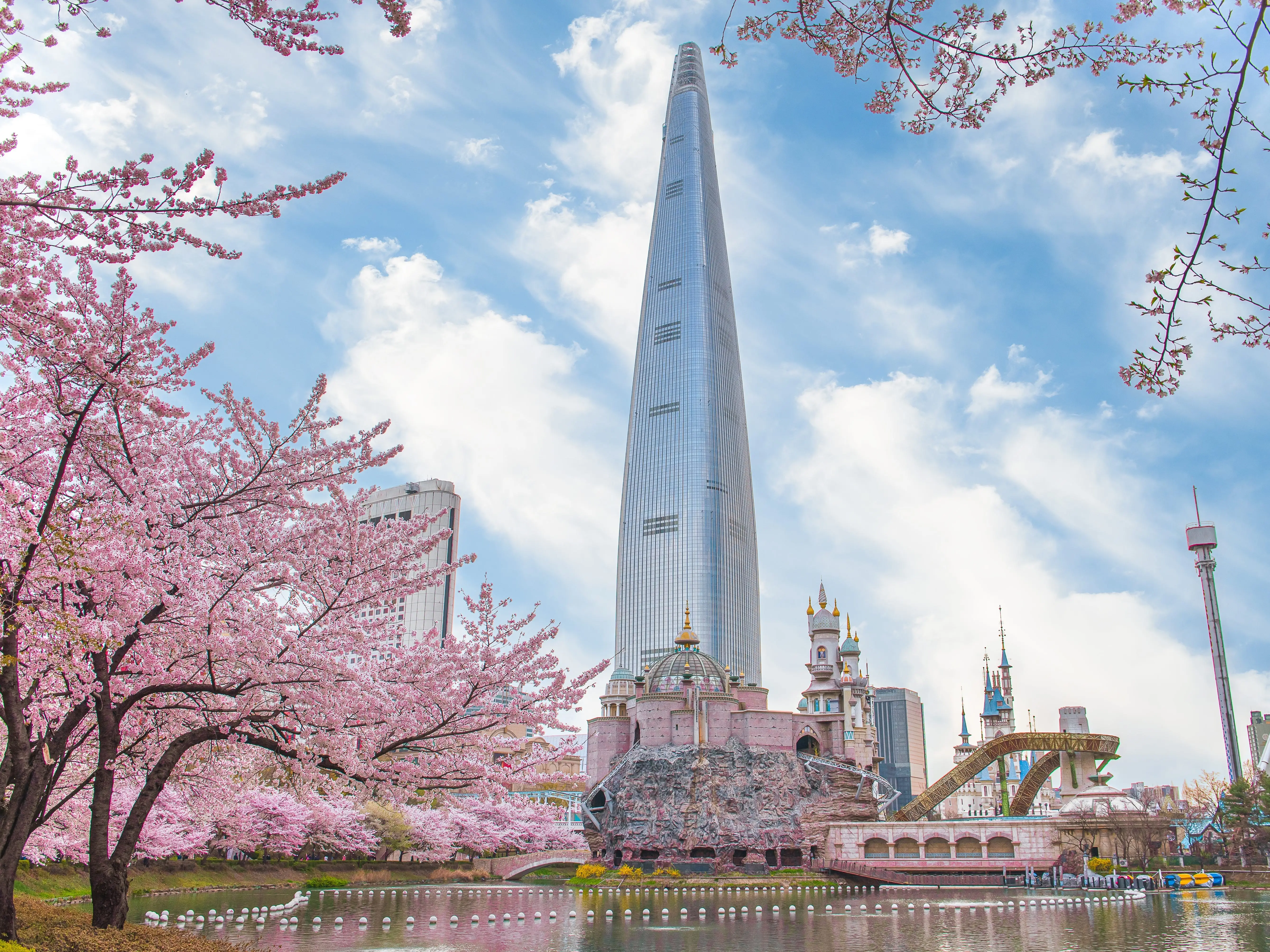 Lotte World Amusement Park and Seokchon Lake  in Spring Cherry blossoms bloom in late March-April.  Seoul, South Korea