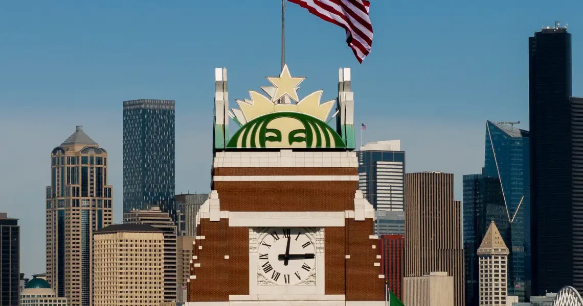 Starbucks says its turnaround is gaining momentum and cuts 300 more jobs