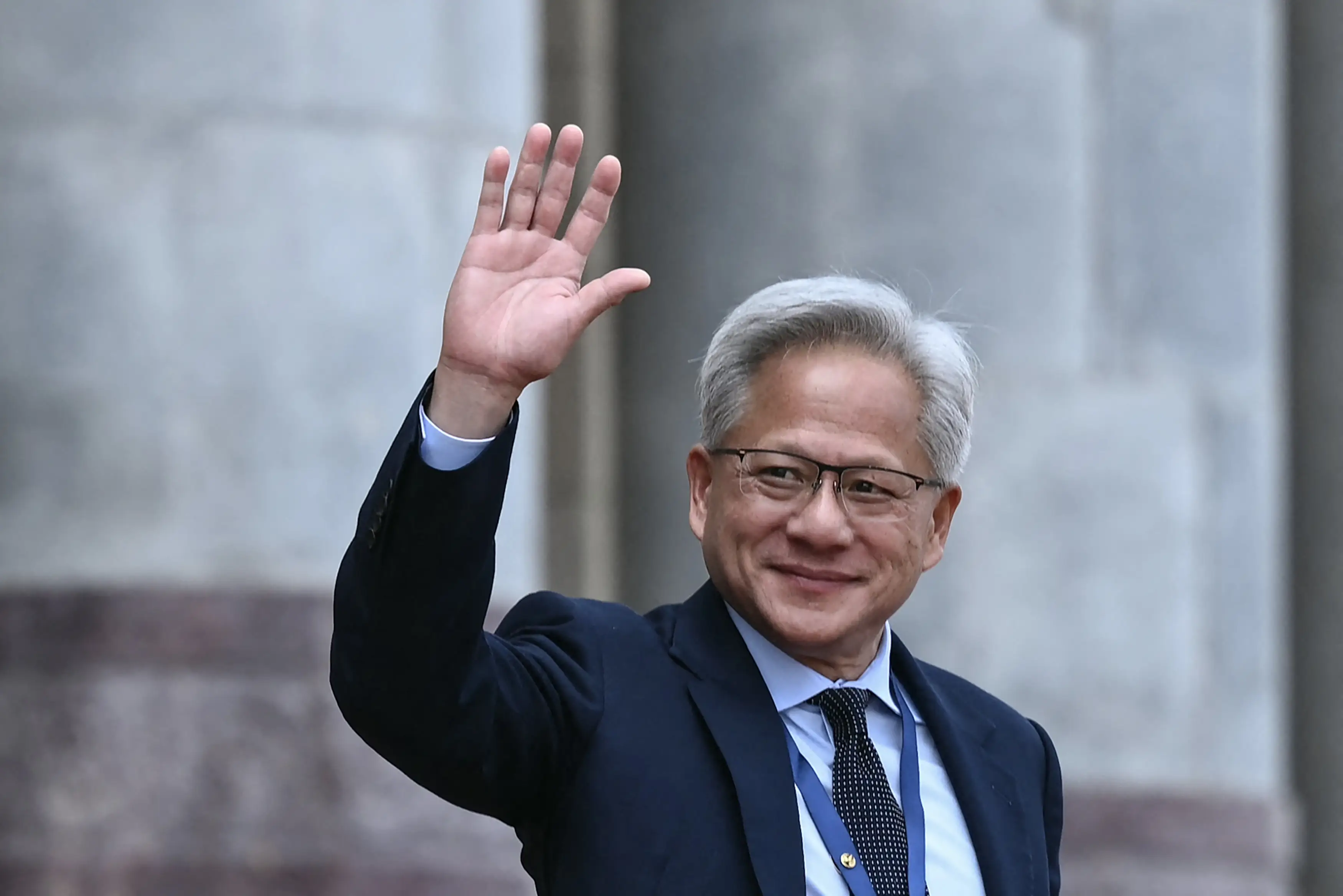 Nvidia CEO Jensen Huang waves during his China trip.