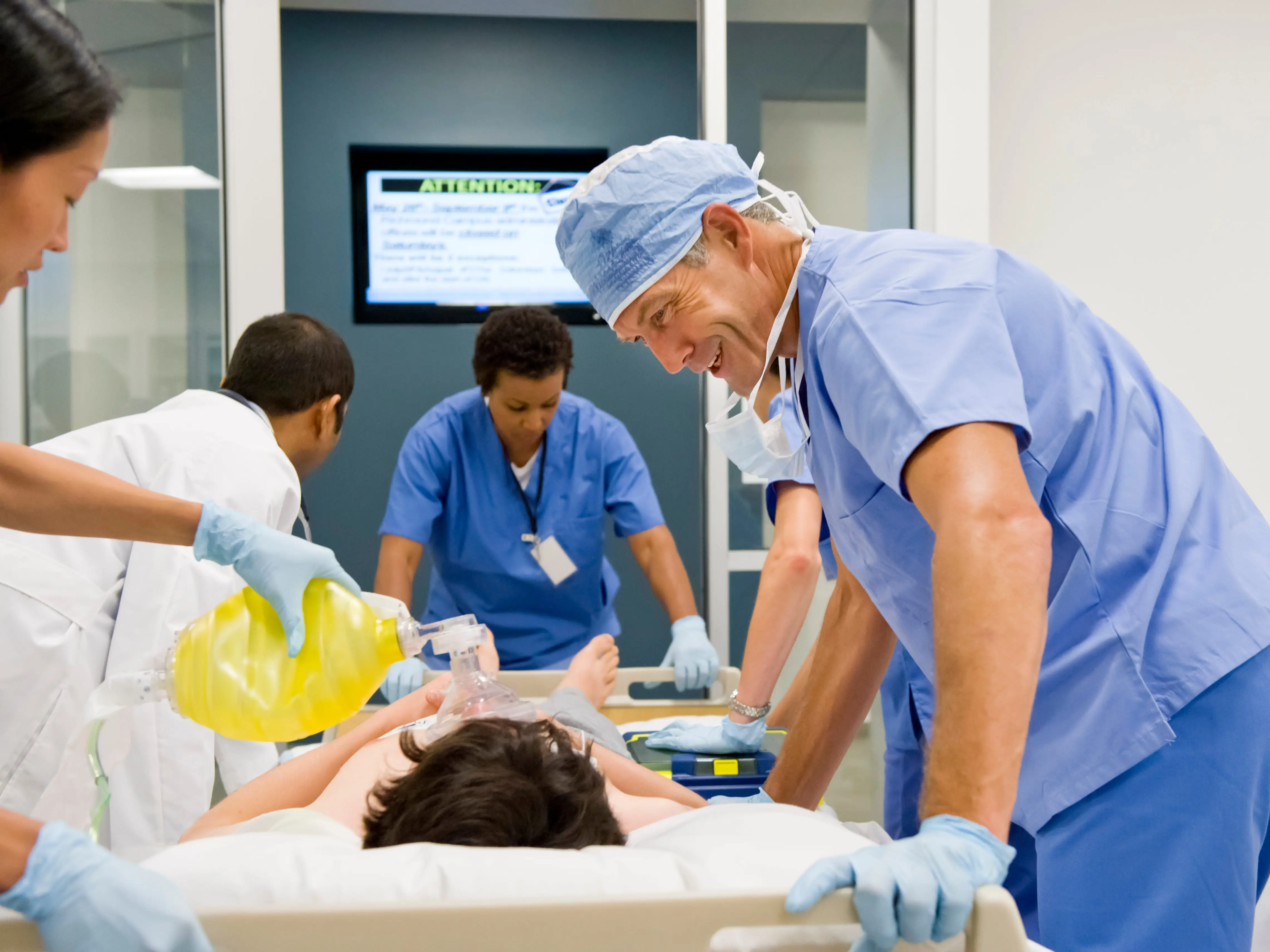Healthcare workers with a patient in an emergency room