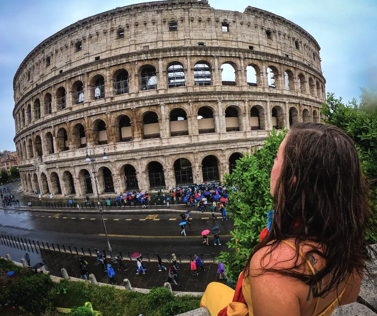 The writer gazing out at the Colosseum in Rome, Italy.