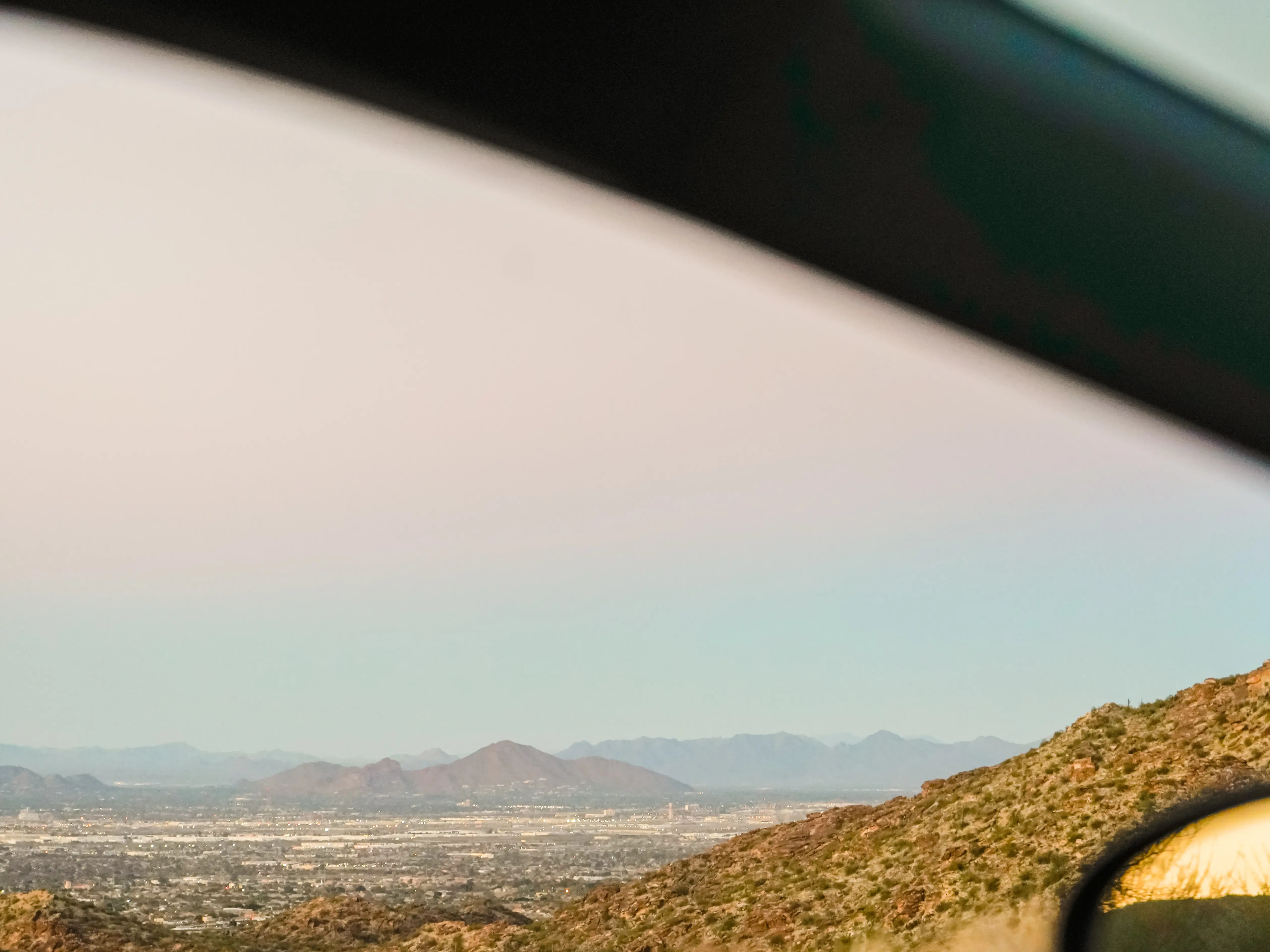 A view of mountains out a car window