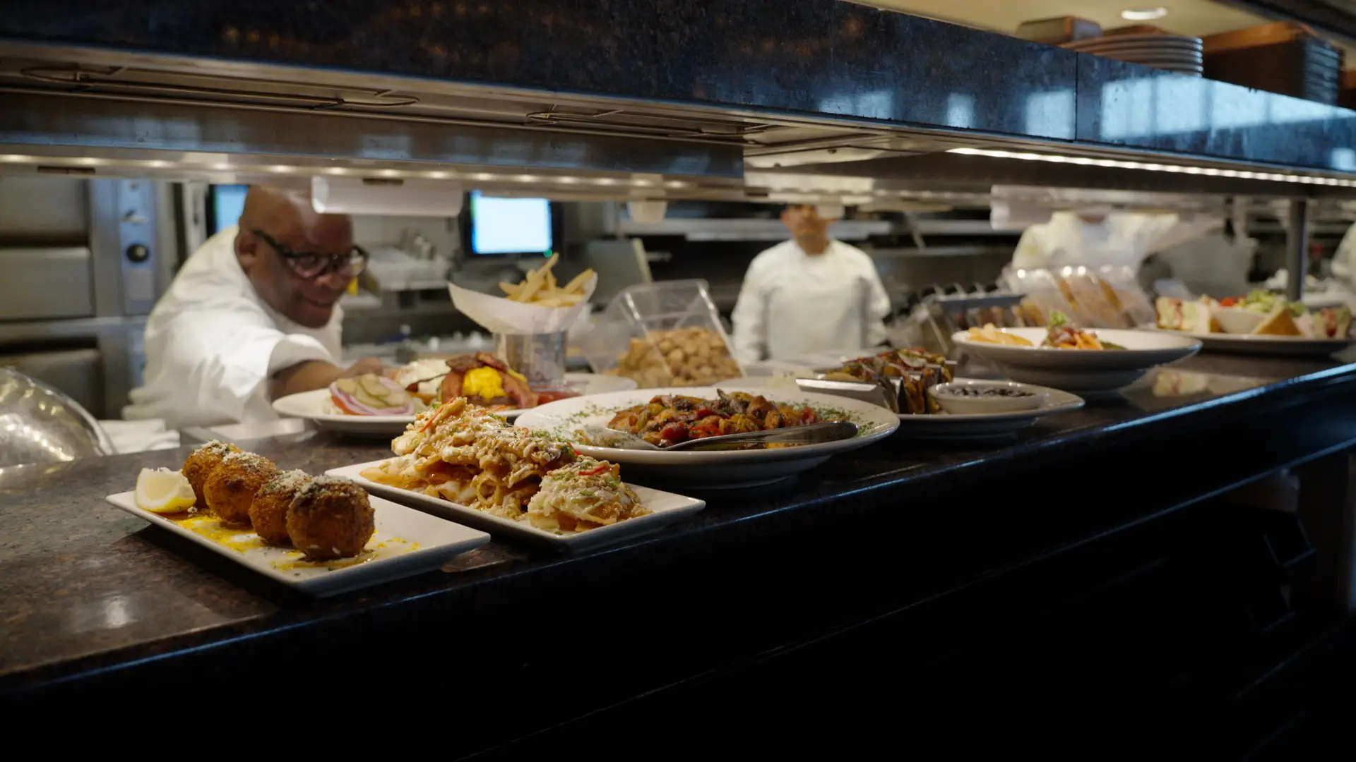 Jay Hinson putting a plate up for order at The Cheesecake Factory.