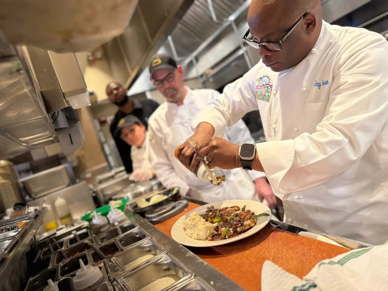 Jay Hinson preparing a plate at The Cheesecake Factory.