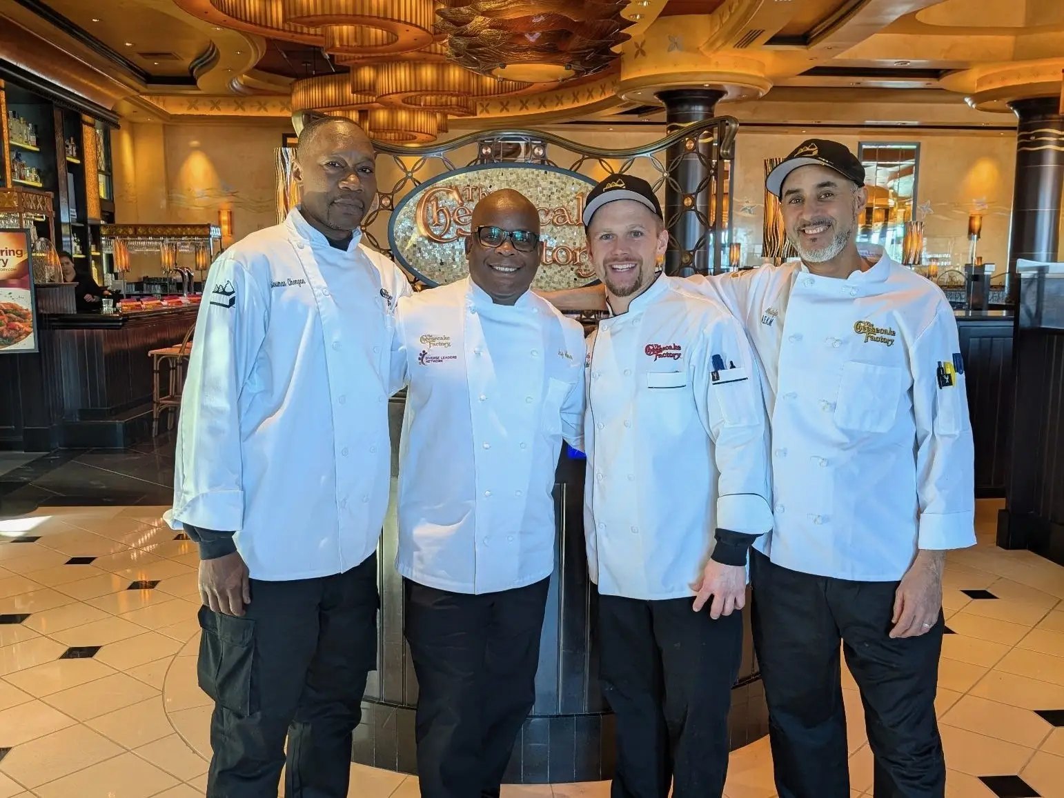 Jay Hinson with a group of employees from The Cheesecake Factory.