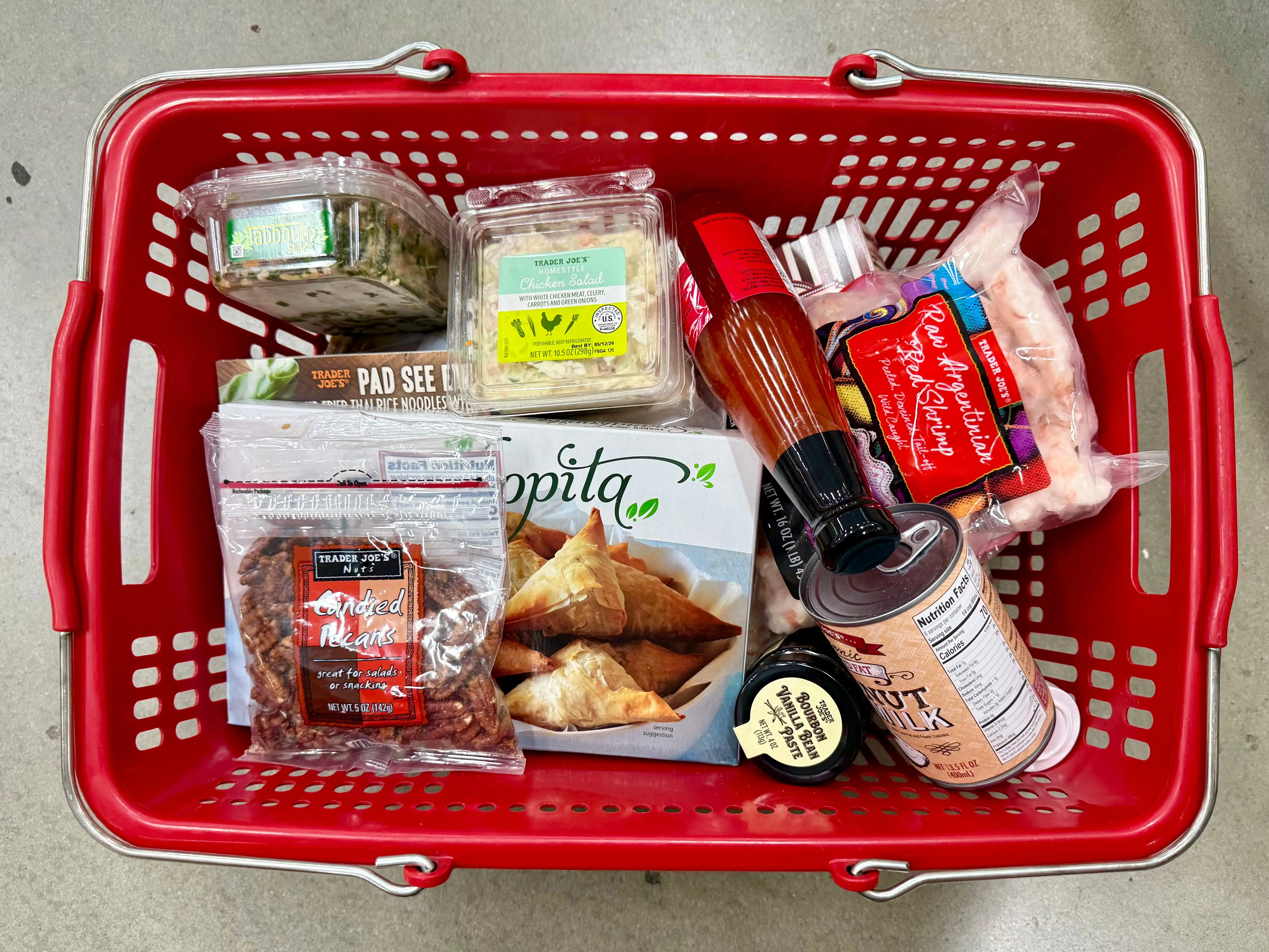A basket full of Trader Joe's groceries.
