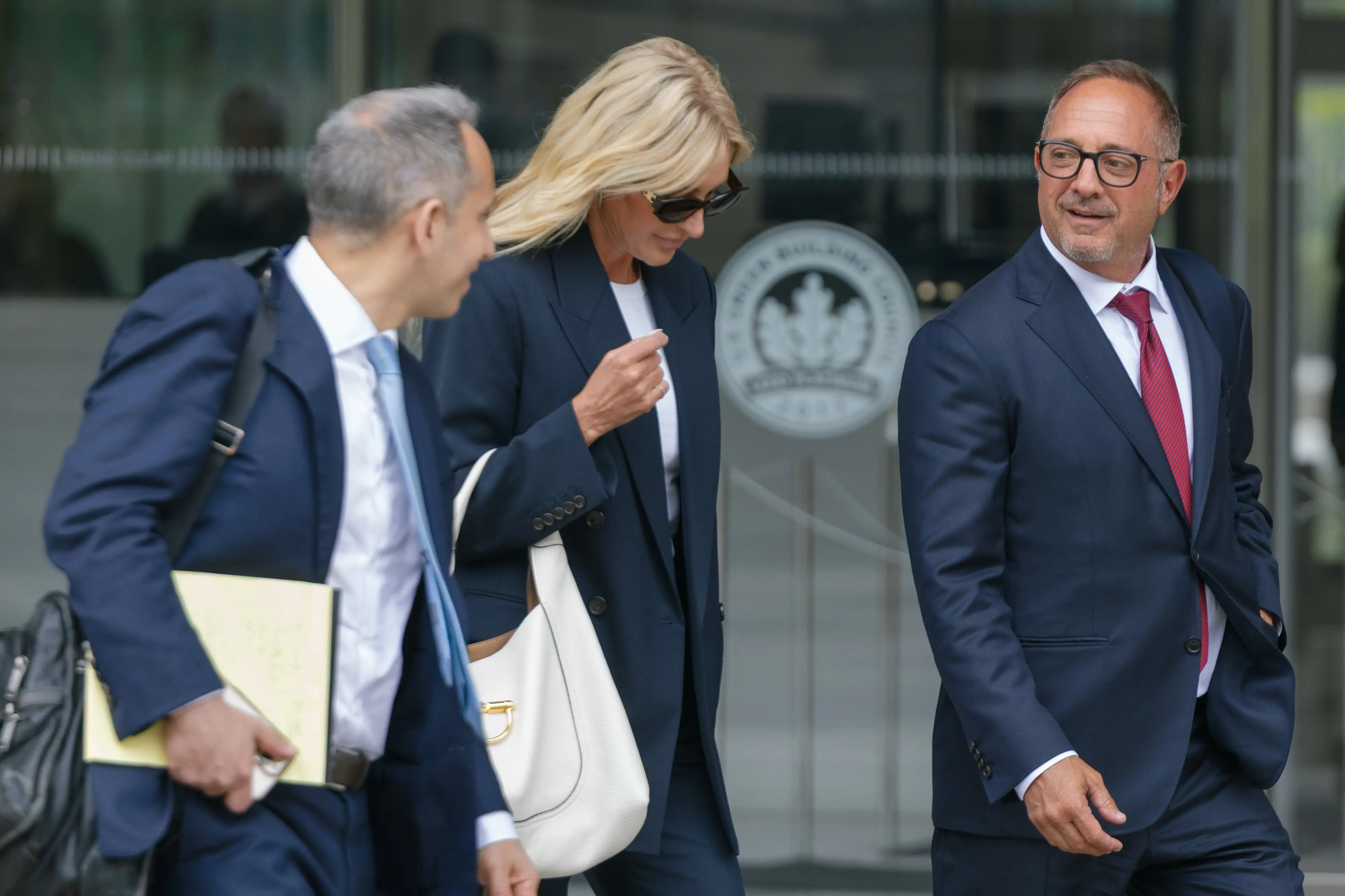Andrew Left walking outside court.