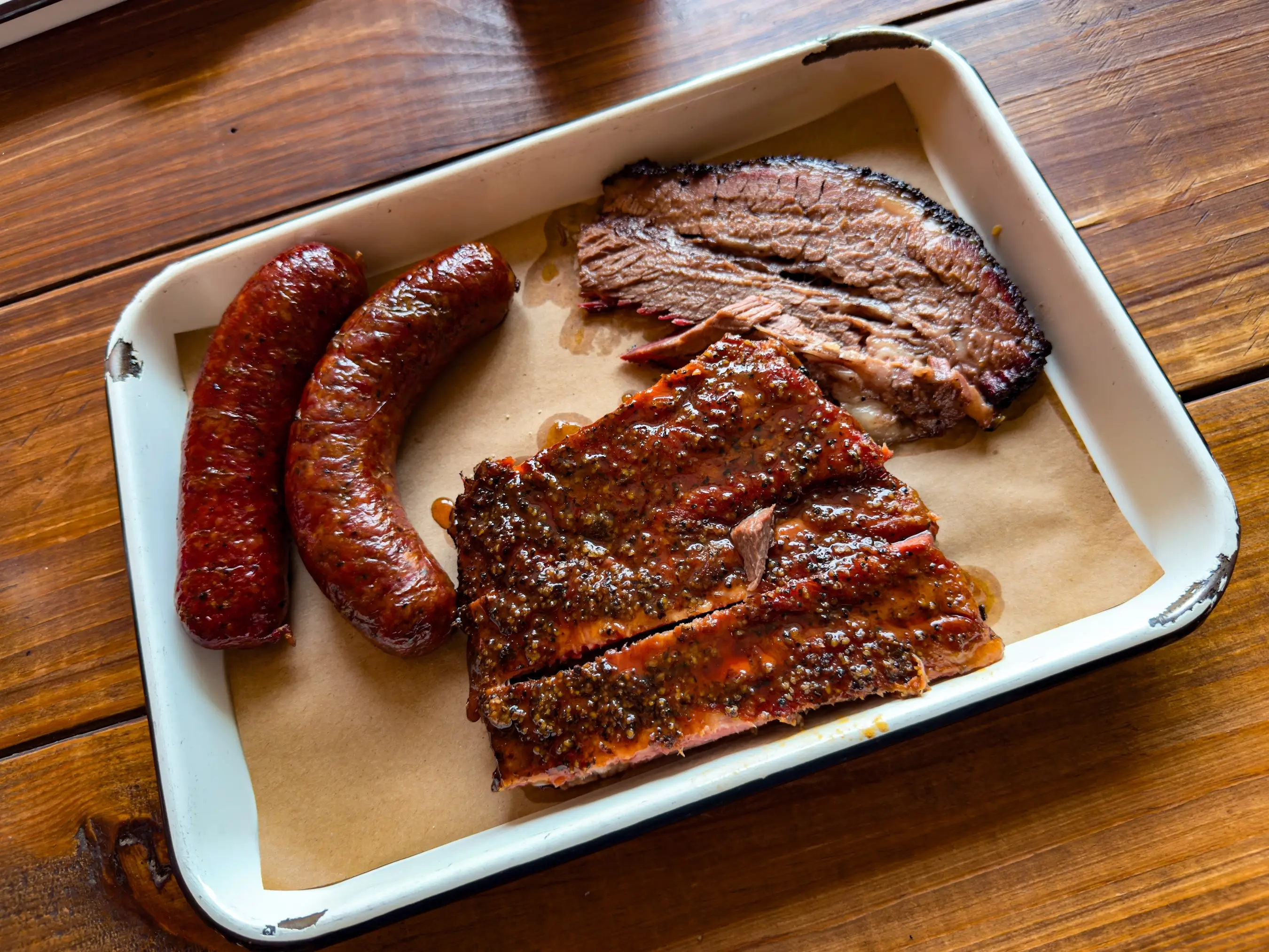 Meat on a tray at a barbecue joint.