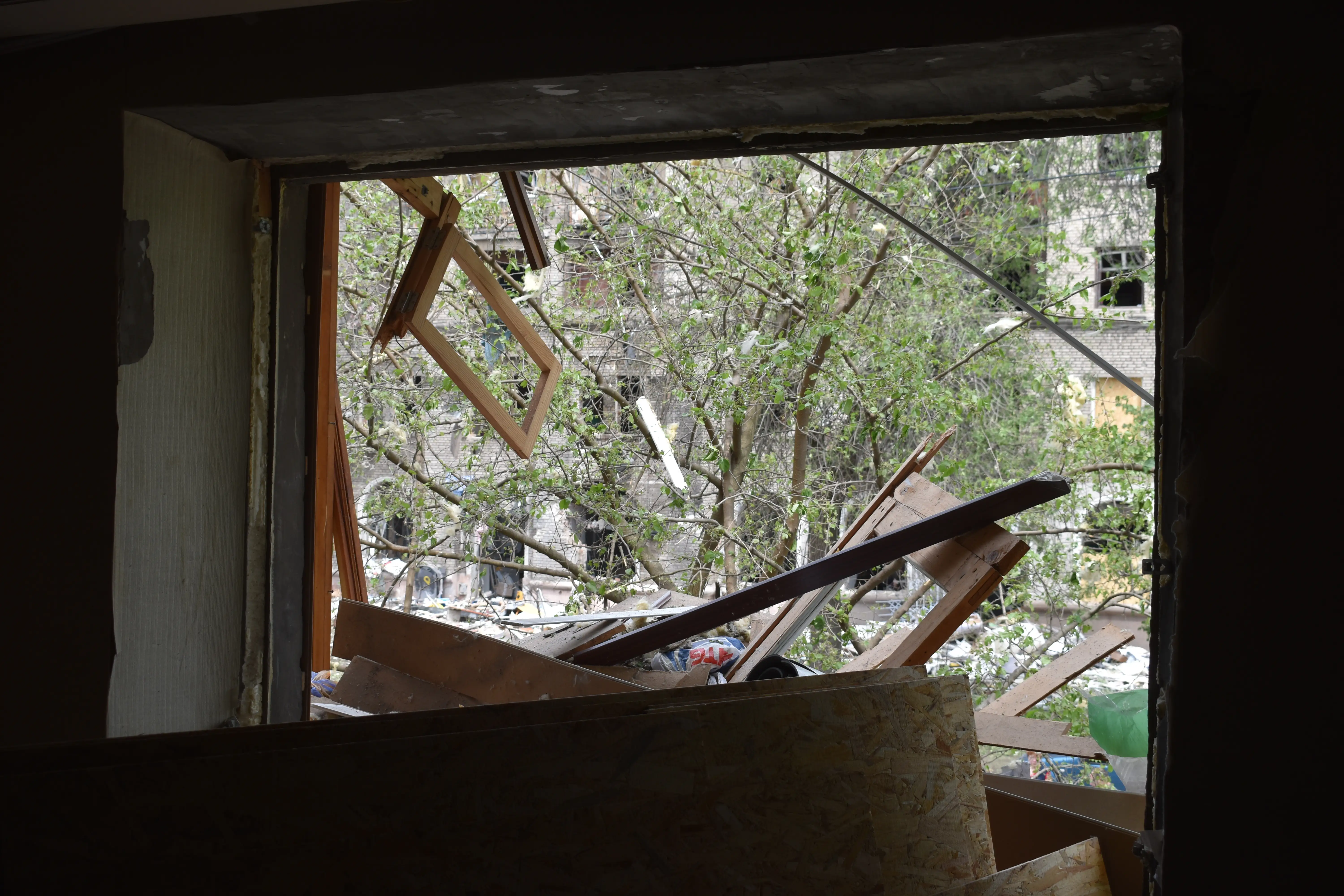 Inside a residential building hit by shrapnel.