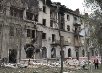 ‘Thank God, I’m alive’: A Russian attack tore open this Ukrainian neighborhood, but residents were quick to start picking up the pieces