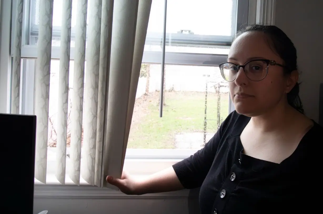 Michelle Cavitolo standing next to an open window