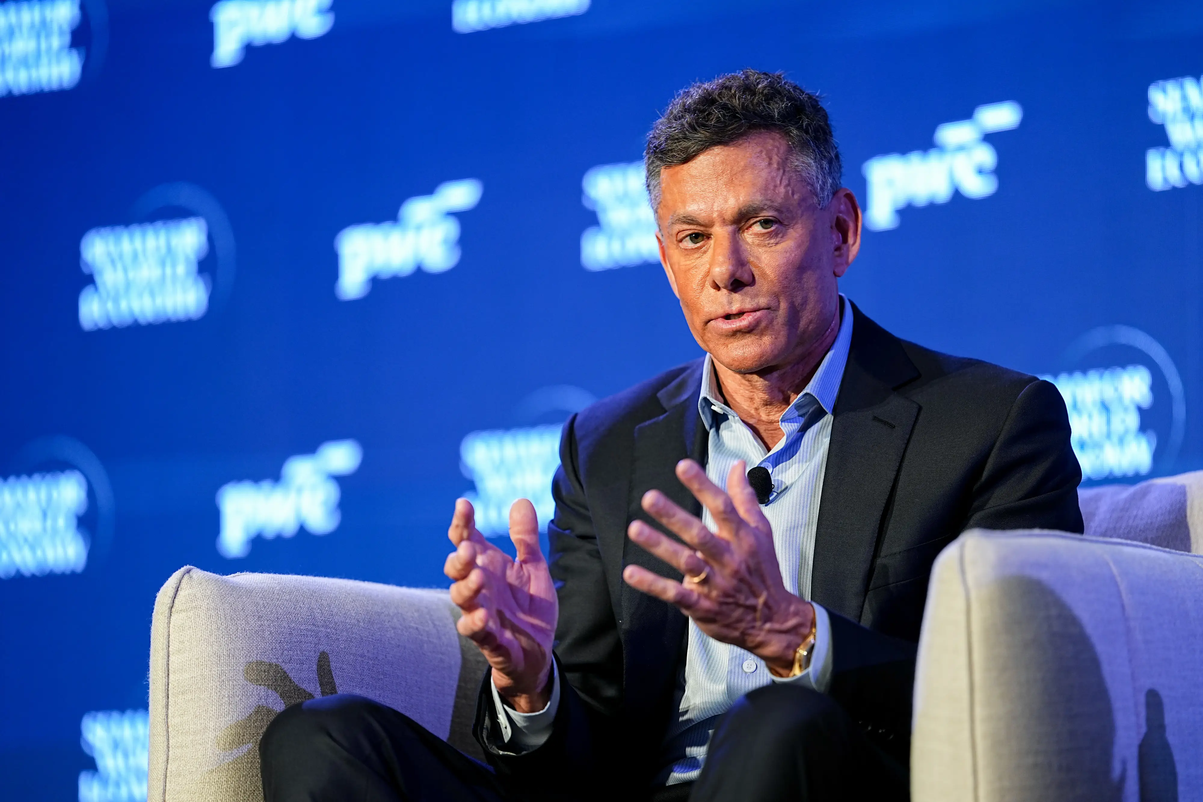Strauss Zelnick, the CEO of Take-Two Interactive, sits in an armchair onstage.