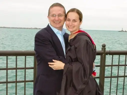 The author, after her grad school graduation, with her husband at Navy Pier in Chicago.
