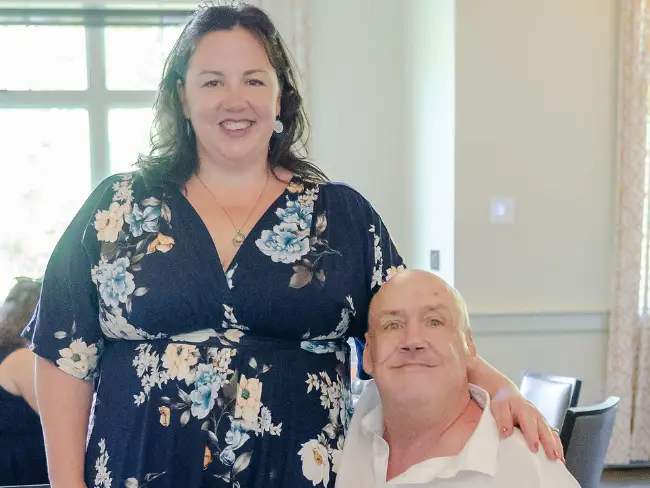 Daughter and dad posing for photo