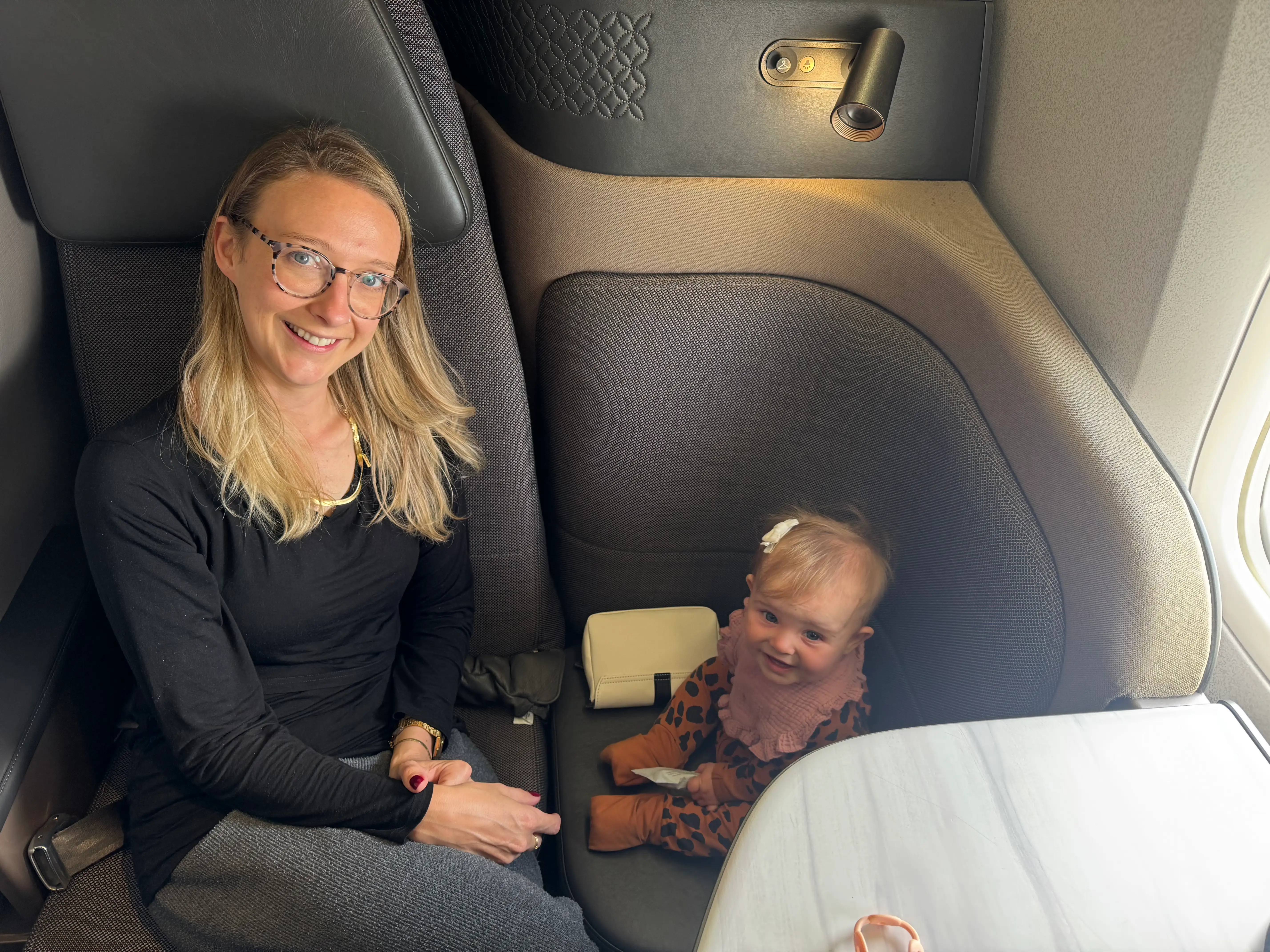 woman and baby in business class Q suite