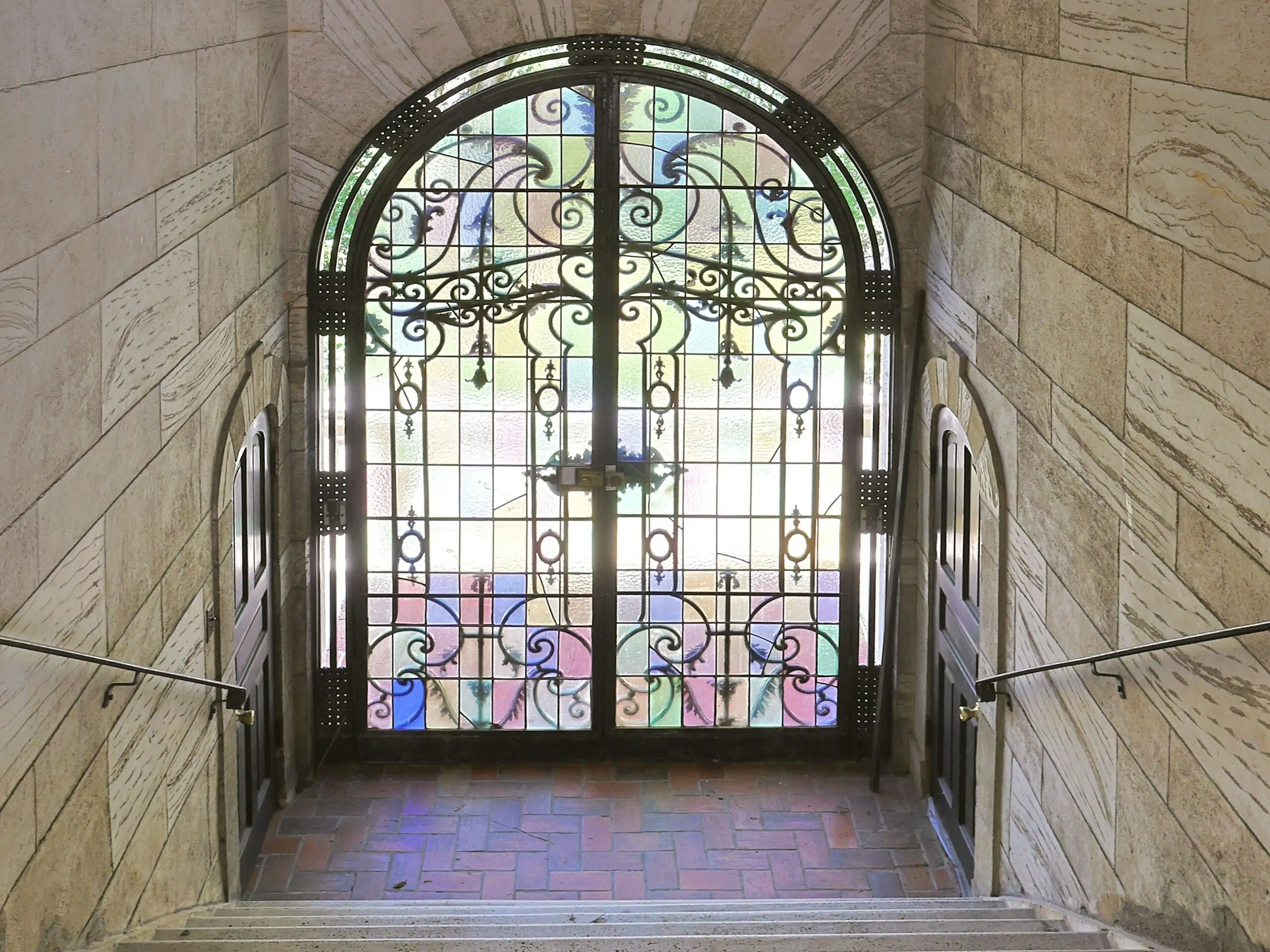 Stained glass door at end of a staircase