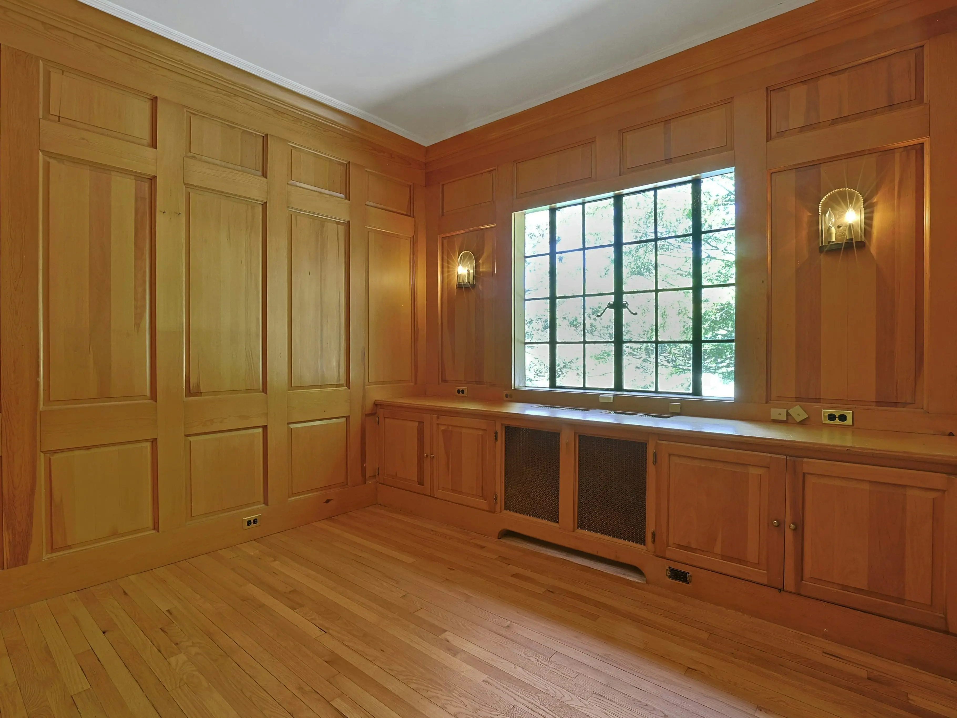 Room with wooden paneling.