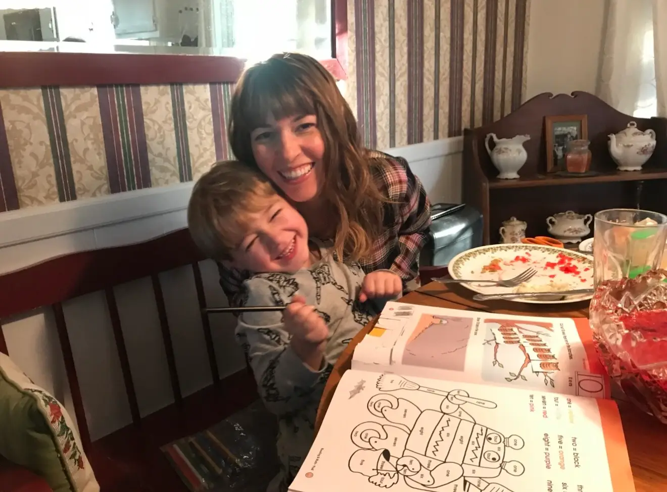 The author with her son at the table.