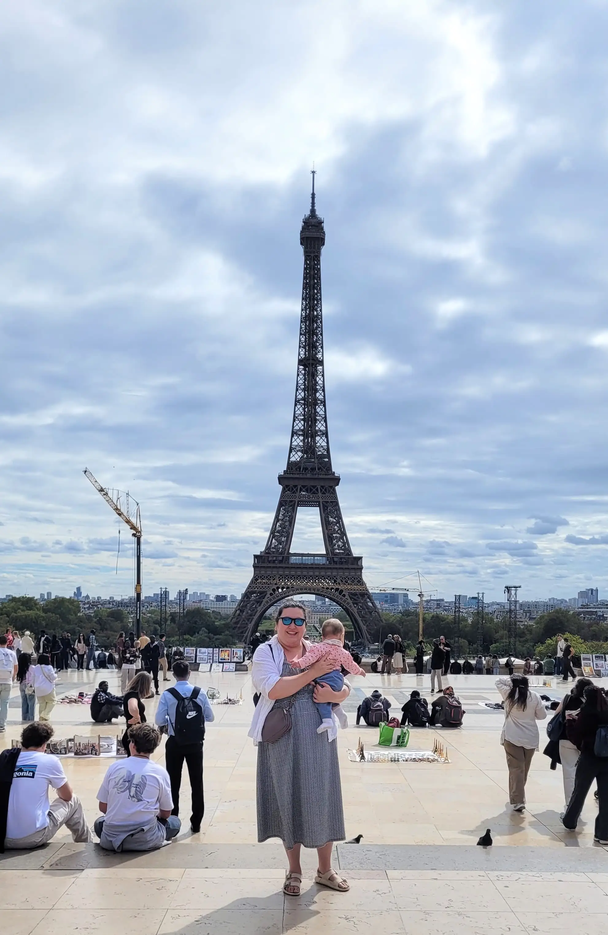 The author with her baby in front of the Eiffel Tower