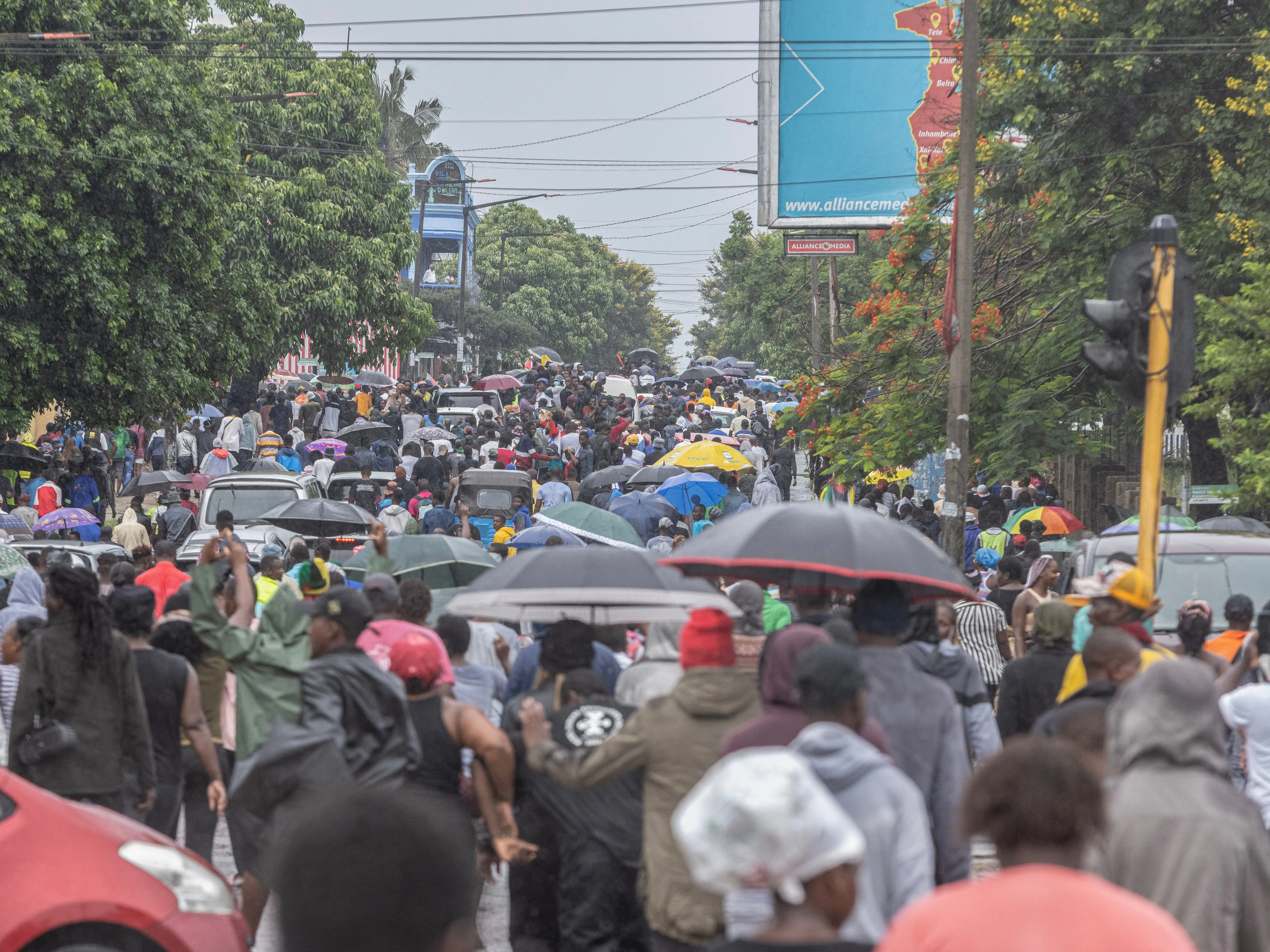 Crowd with umbrellas in Maputo, Mozambique.