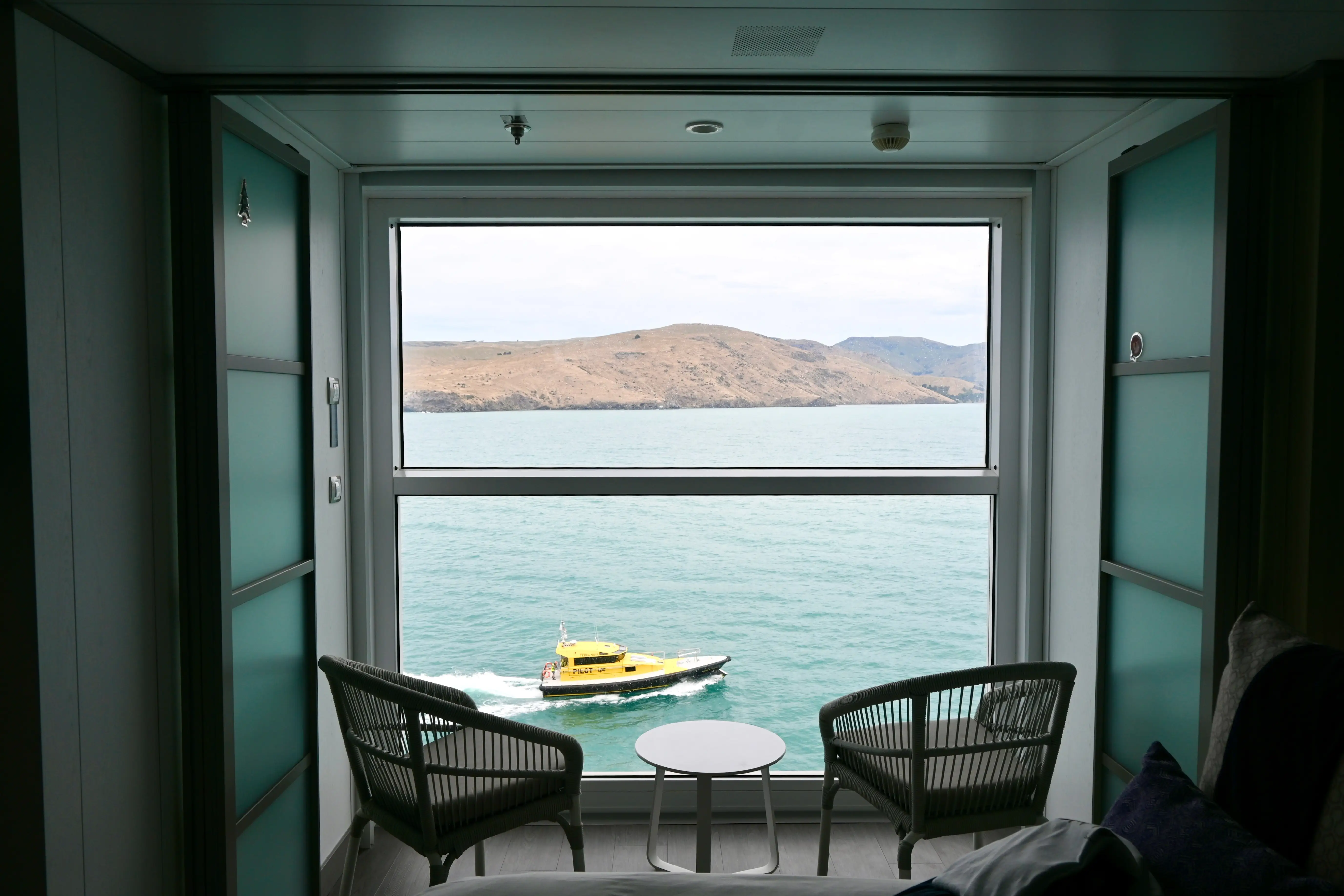View from floor-to-ceiling windows of water from Infinite Veranda cabin on Celebrity cruise