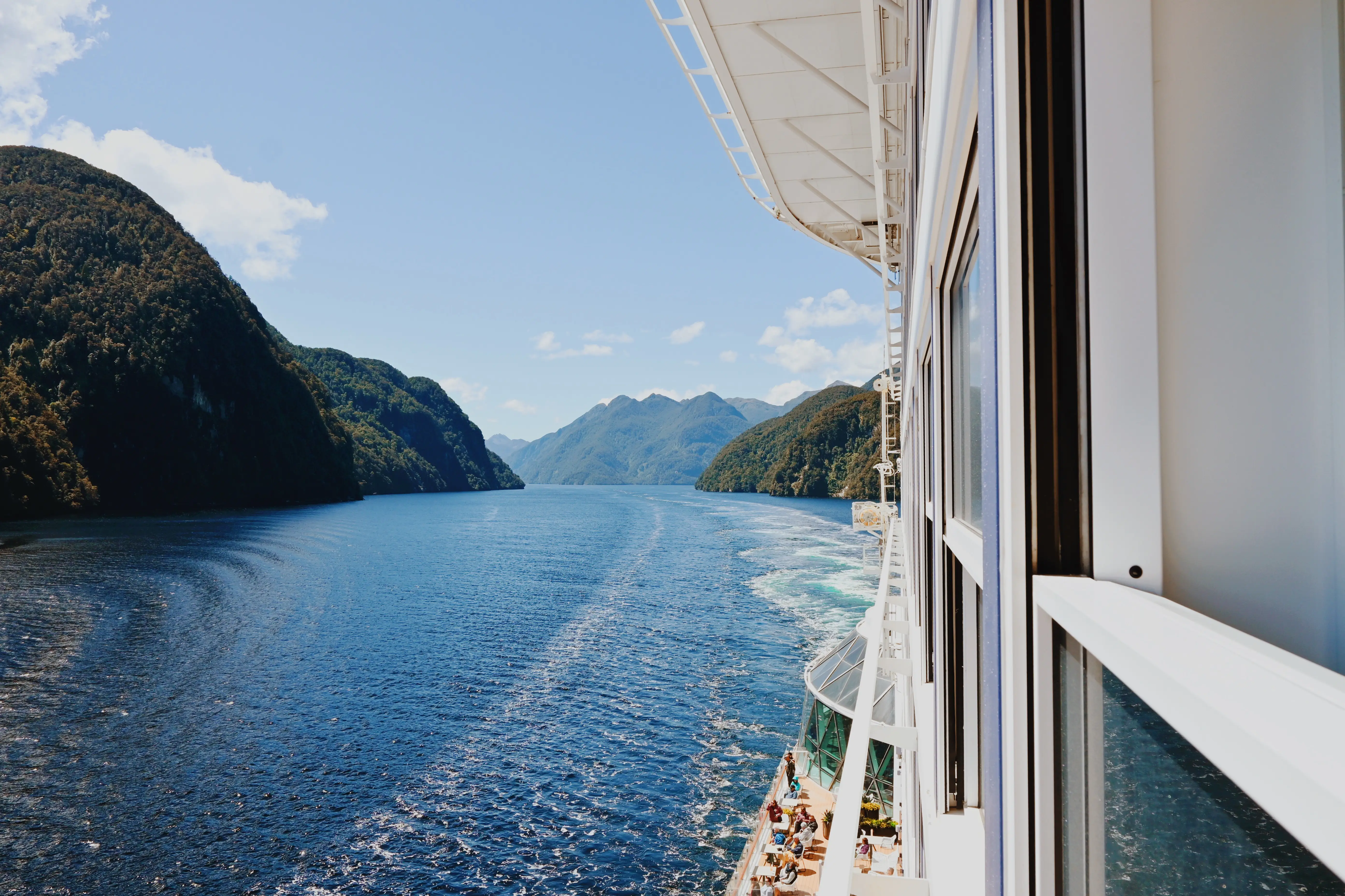 View of water, mountains in distance from Infinite Veranda cabin on Celebrity cruise