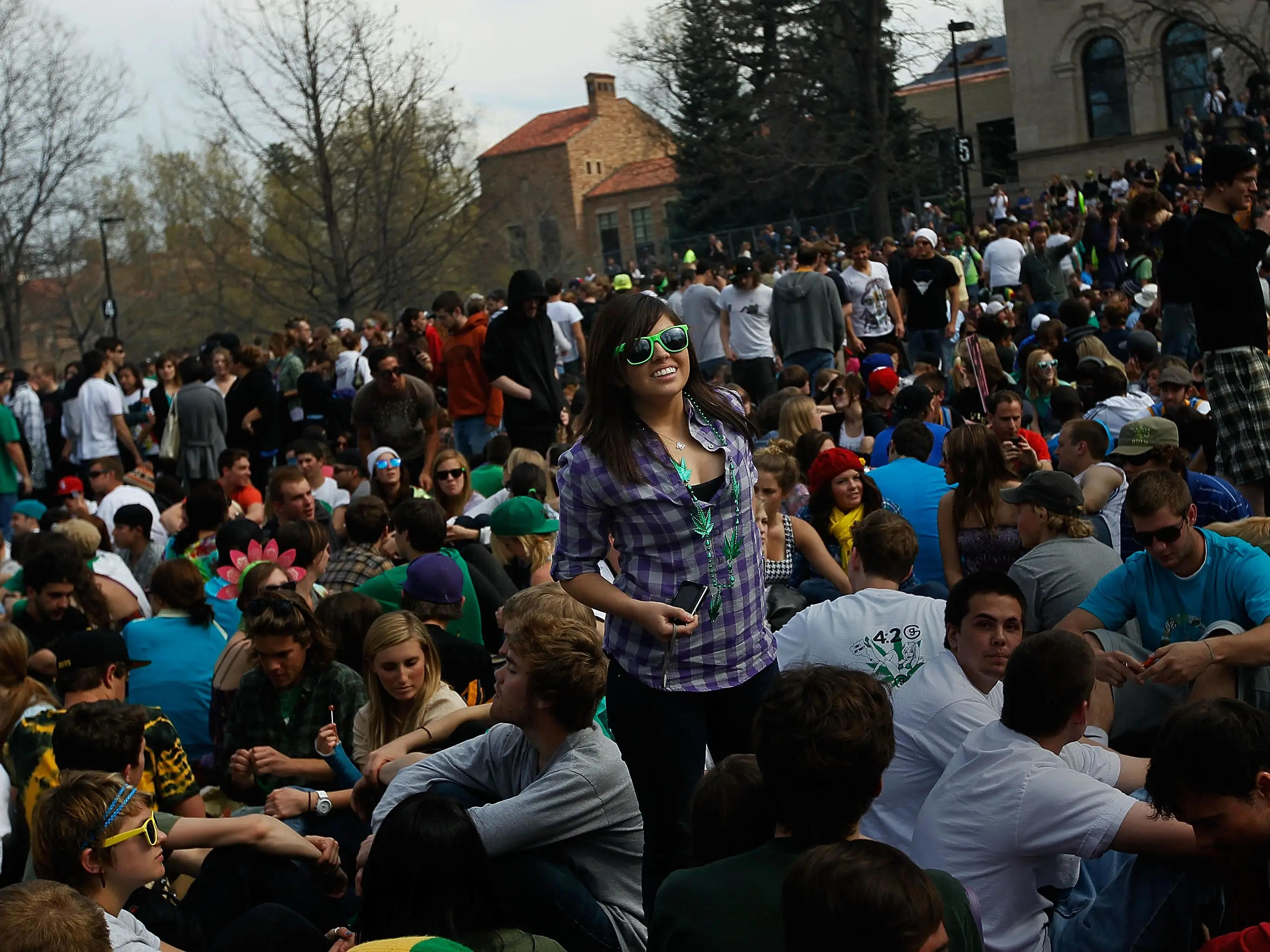 A young woman stands in the crowd during a 