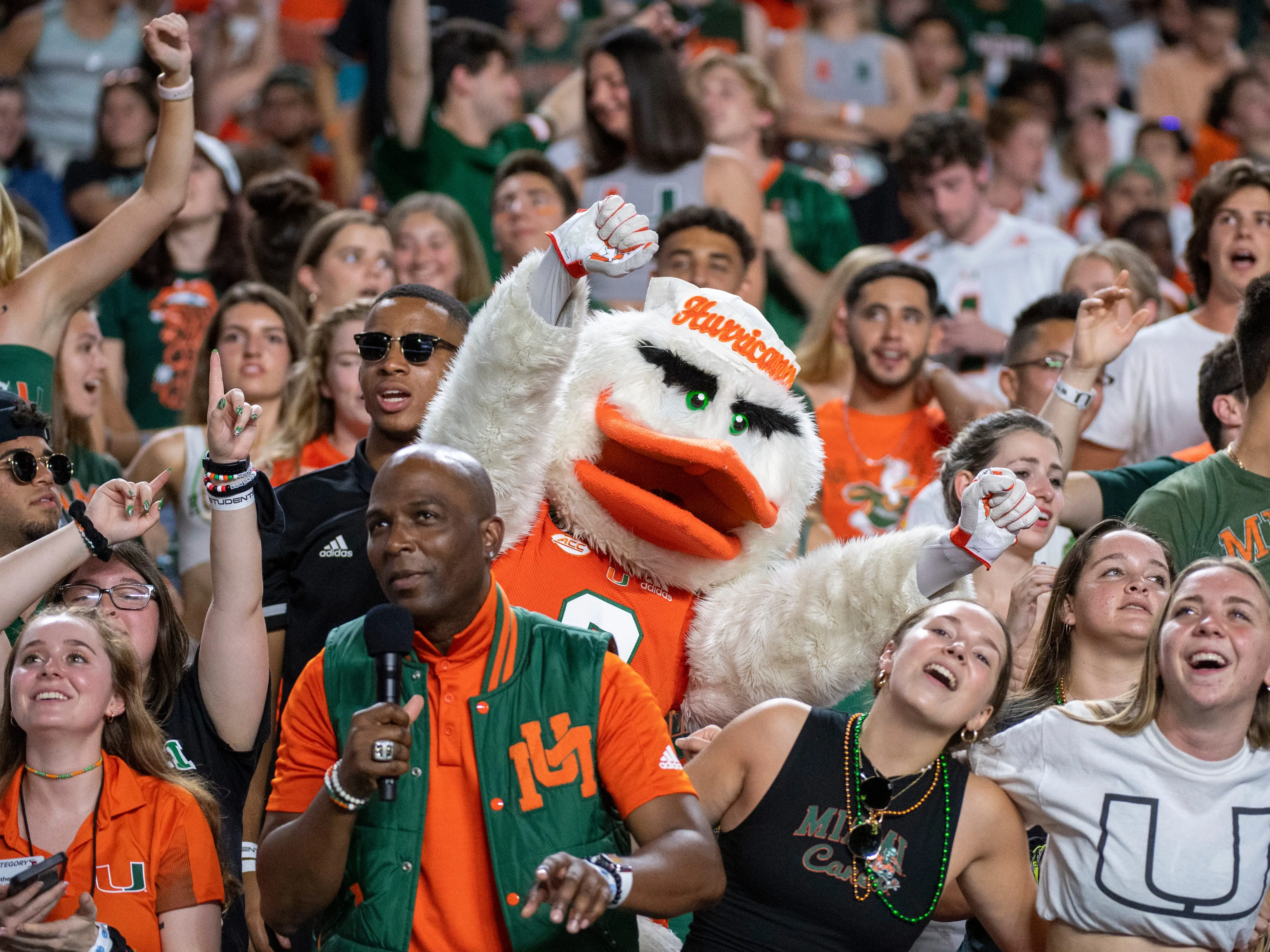 Miami mascot Sebastian the Ibis cheers with Miami students in the stands during the college football game between the Virginia Cavaliers and the University of Miami Hurricanes on September 30, 2021 at the Hard Rock Stadium in Miami Gardens, FL.