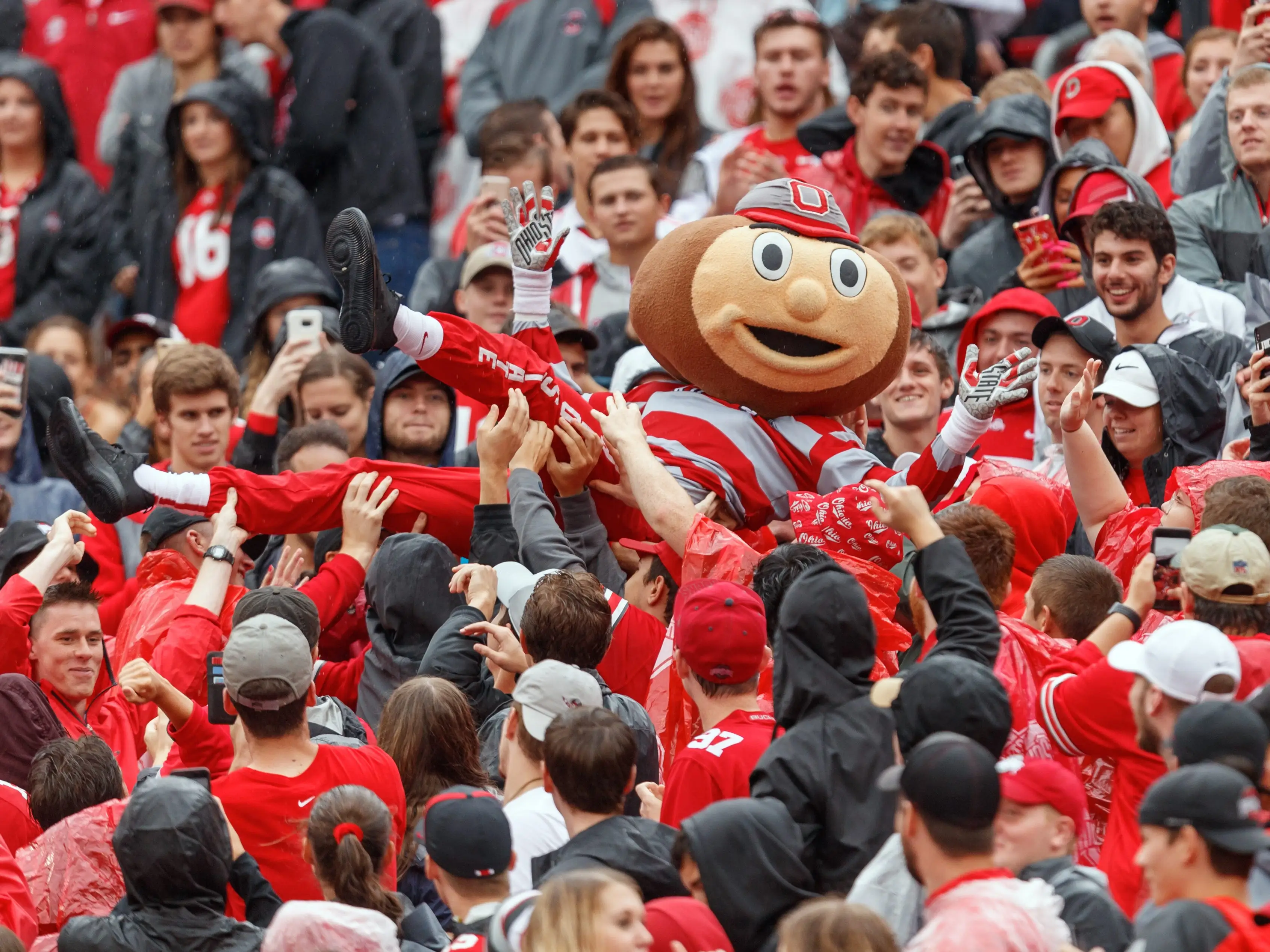 Ohio State Buckeyes mascot, Brutus, crowd surfs with fans in a game between the Ohio State Buckeyes and the Rutgers Scarlet Nights on September 08, 2018 at Ohio Stadium in Columbus, Ohio.