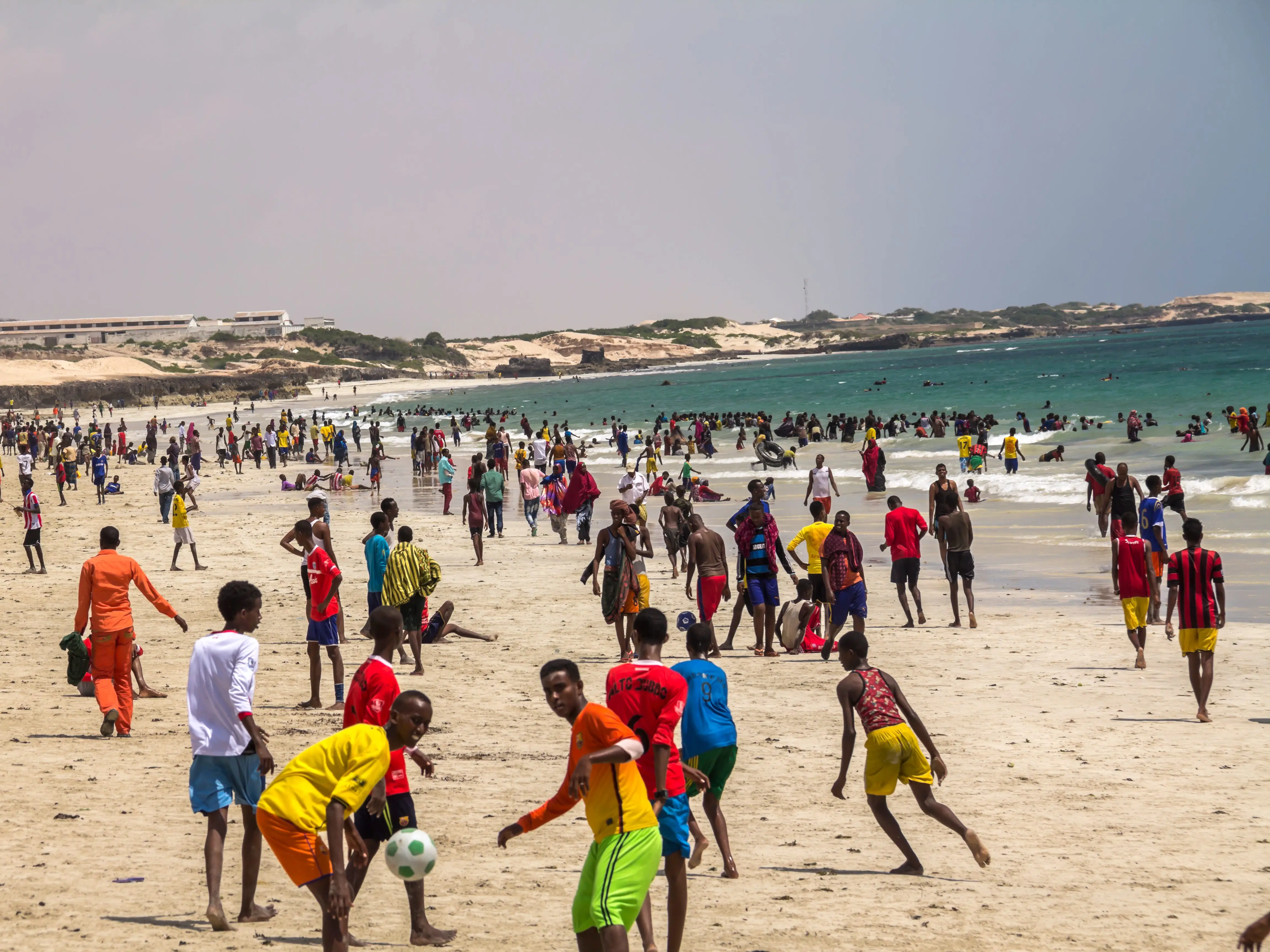 Crowd of people on a beach in Mogadishu, Somalia.