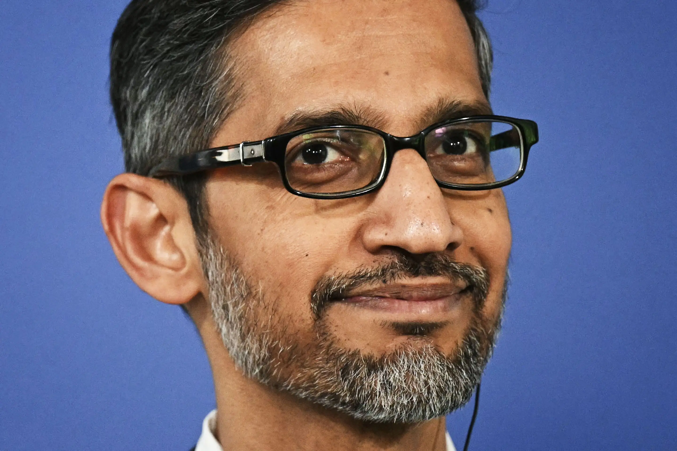 Google CEO Sundar Pichai attends a press conference with Poland's Prime Minister (unseen) after their meeting at the Google Campus on February 13, 2025 in Warsaw, Poland. (Photo by Sergei GAPON / AFP) (Photo by SERGEI GAPON/AFP via Getty Images)