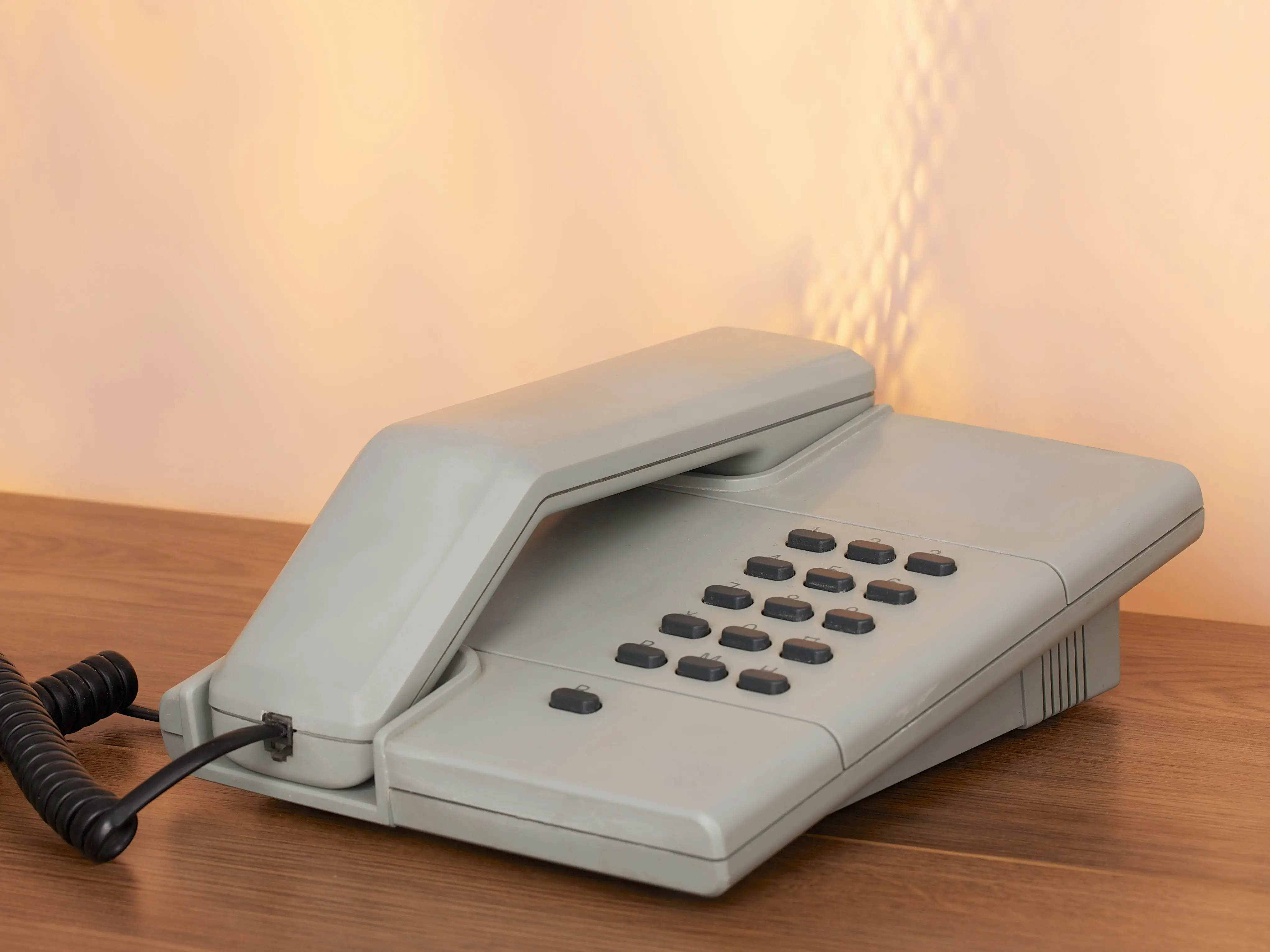 A landline phone on a desk.