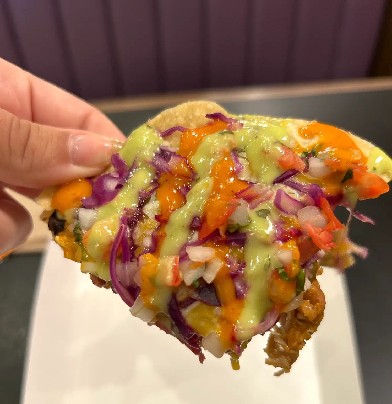 A slice of Taco Bell's Cantina Chicken Mexican Pizza