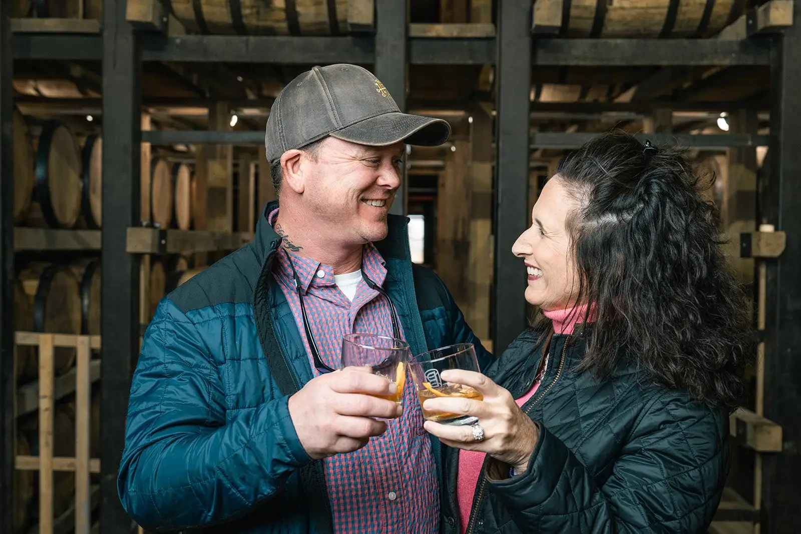 A couple having a glass of bourbon.