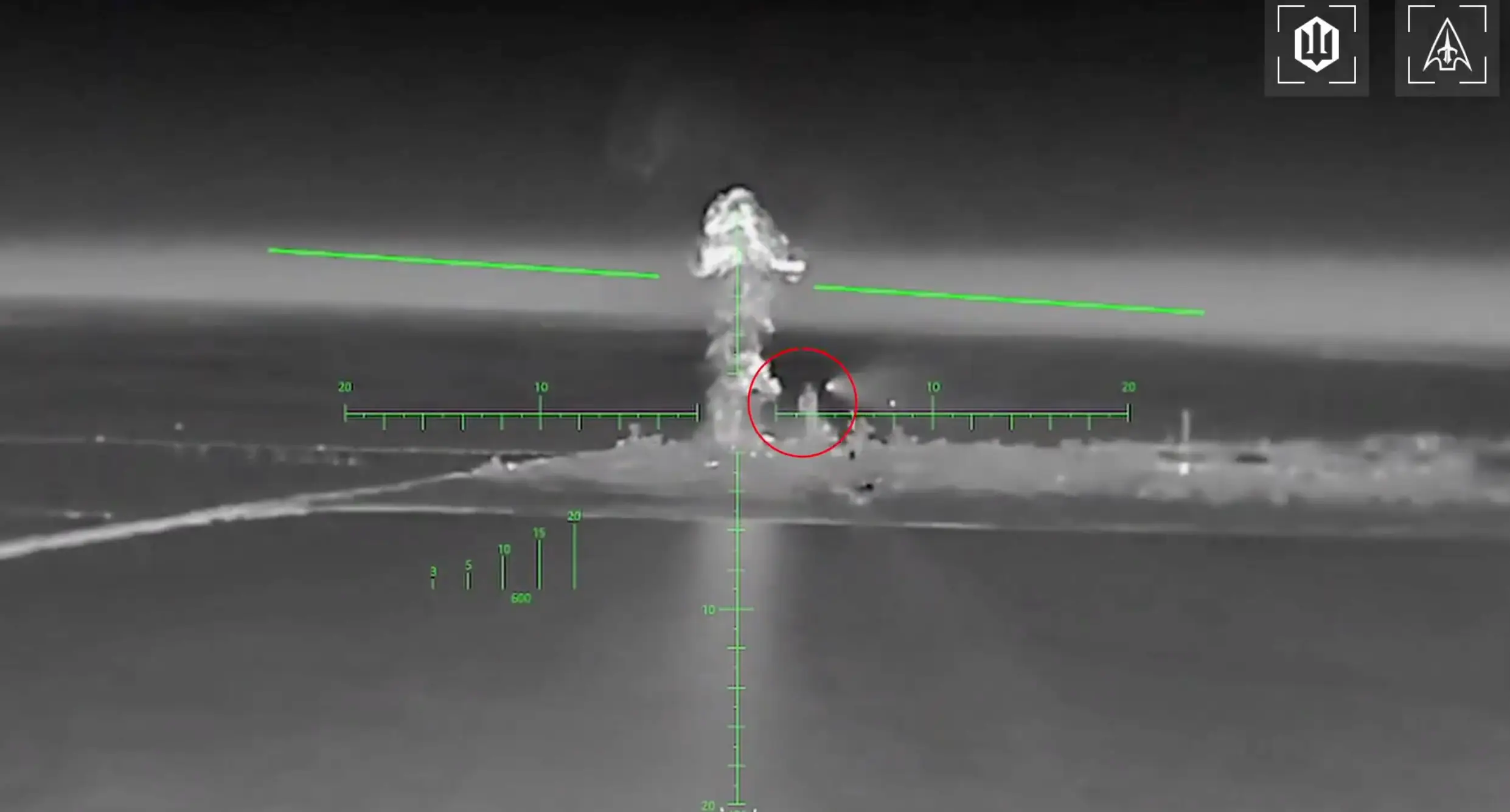 White rocket streaks hurtle toward a ground target.