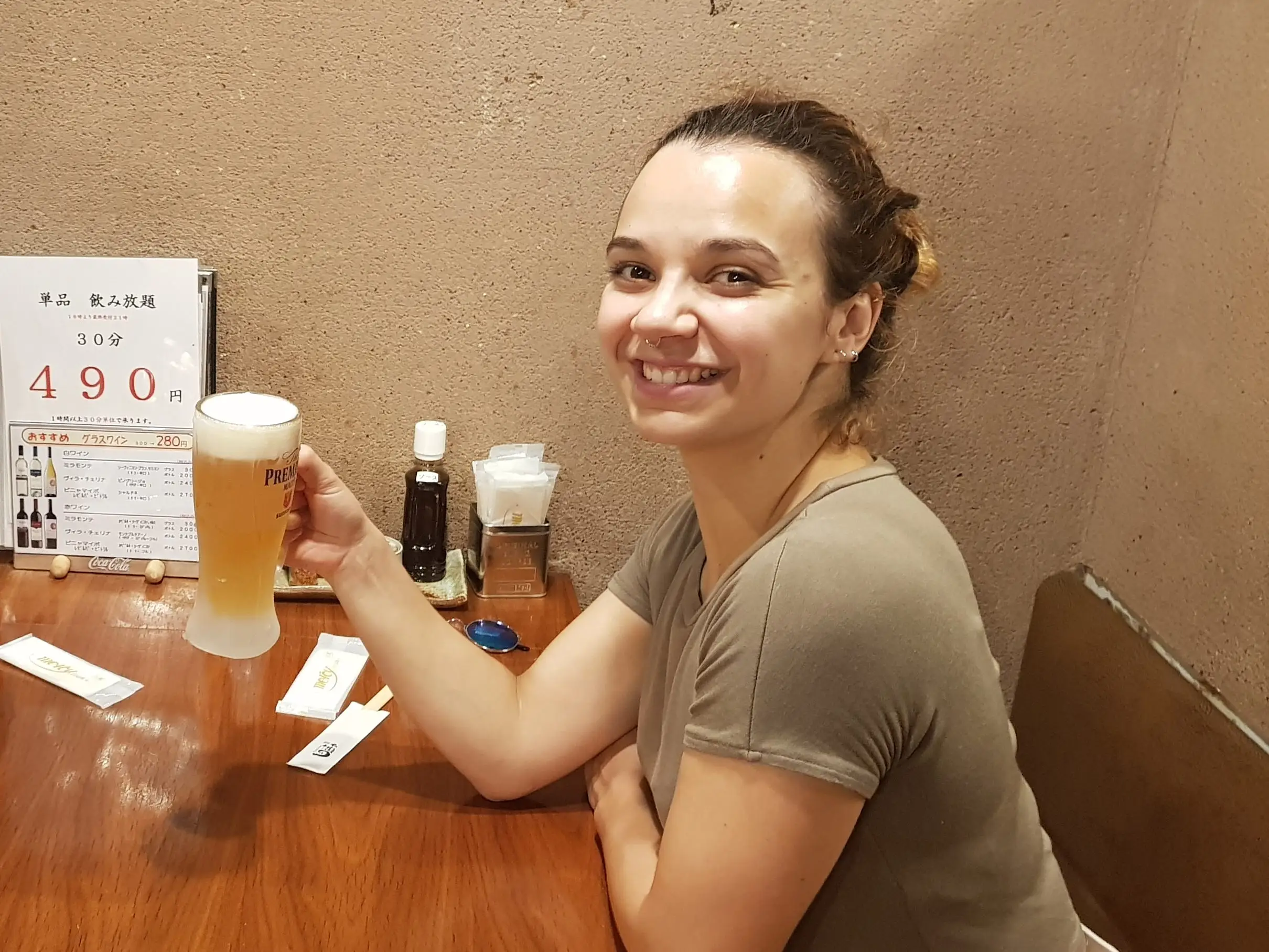 Friends at a bar having beer in Japan.