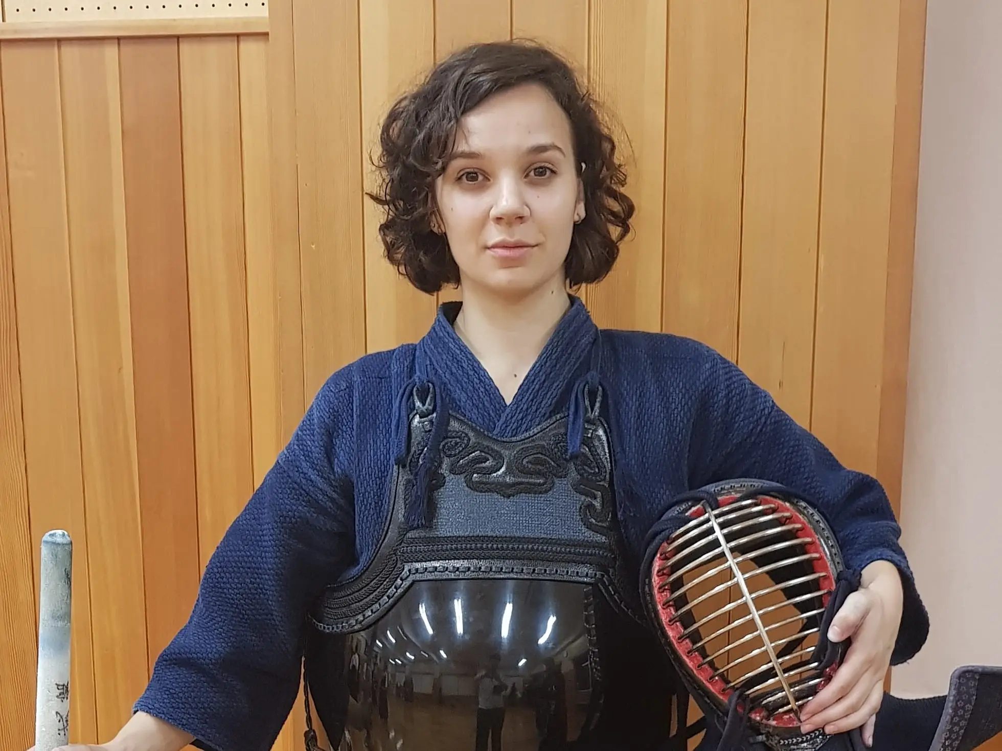 A woman dressed up for kendo fighting in Japan.