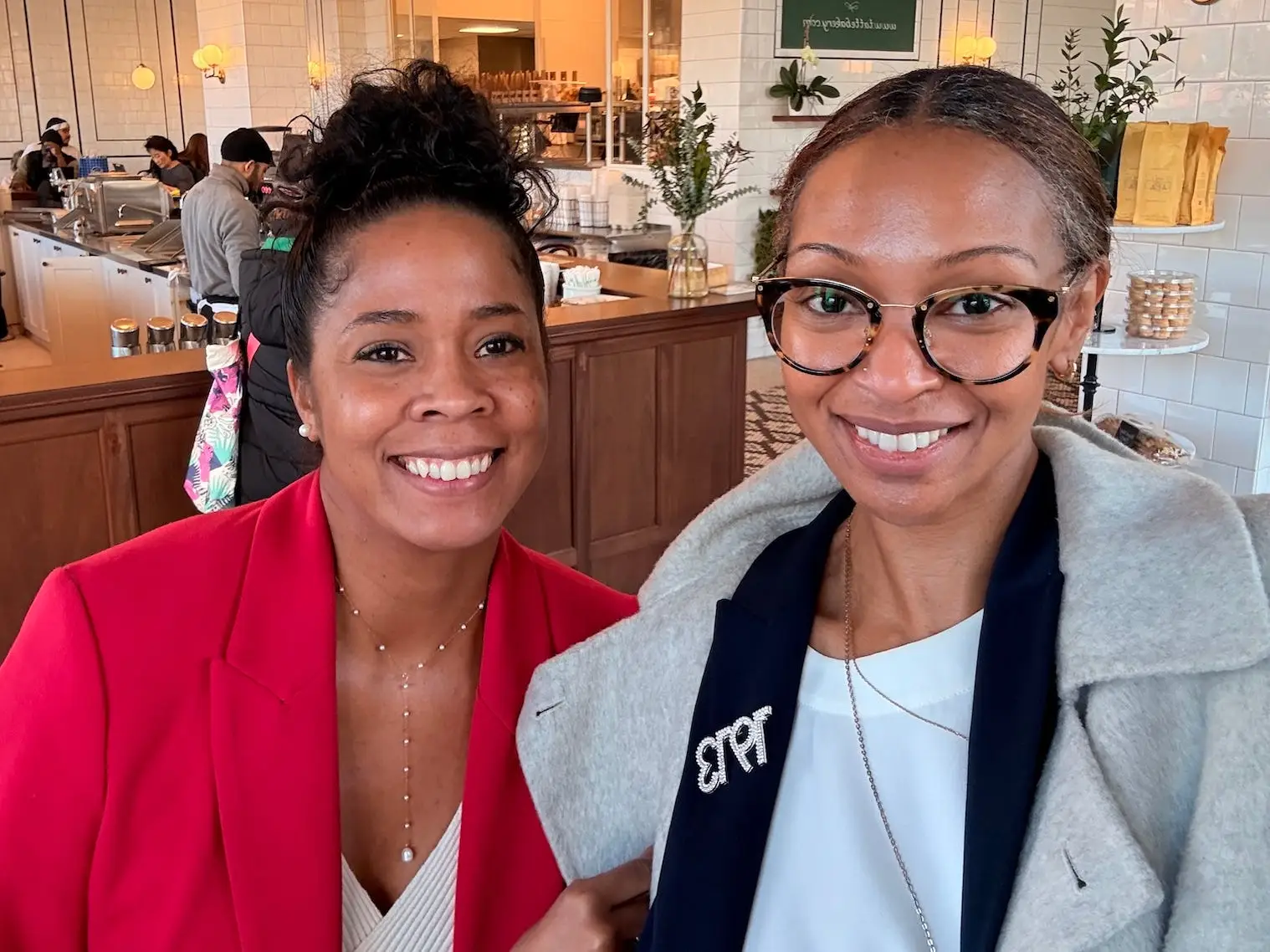 Alexandra Tyson and Felicia Jones Taylor smiling in a selfie