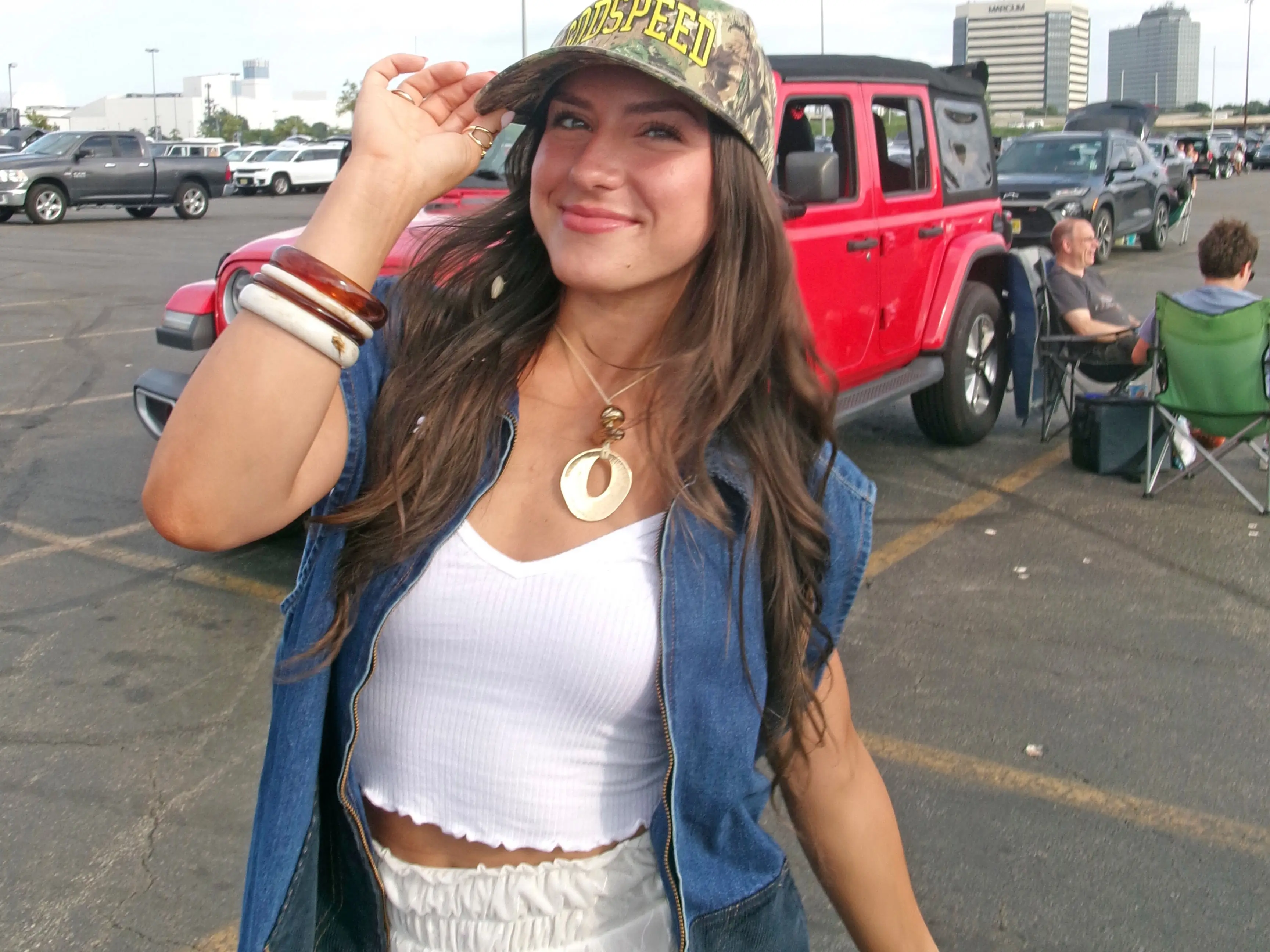 A photo of Amanda wearing her grandmother's denim vest.