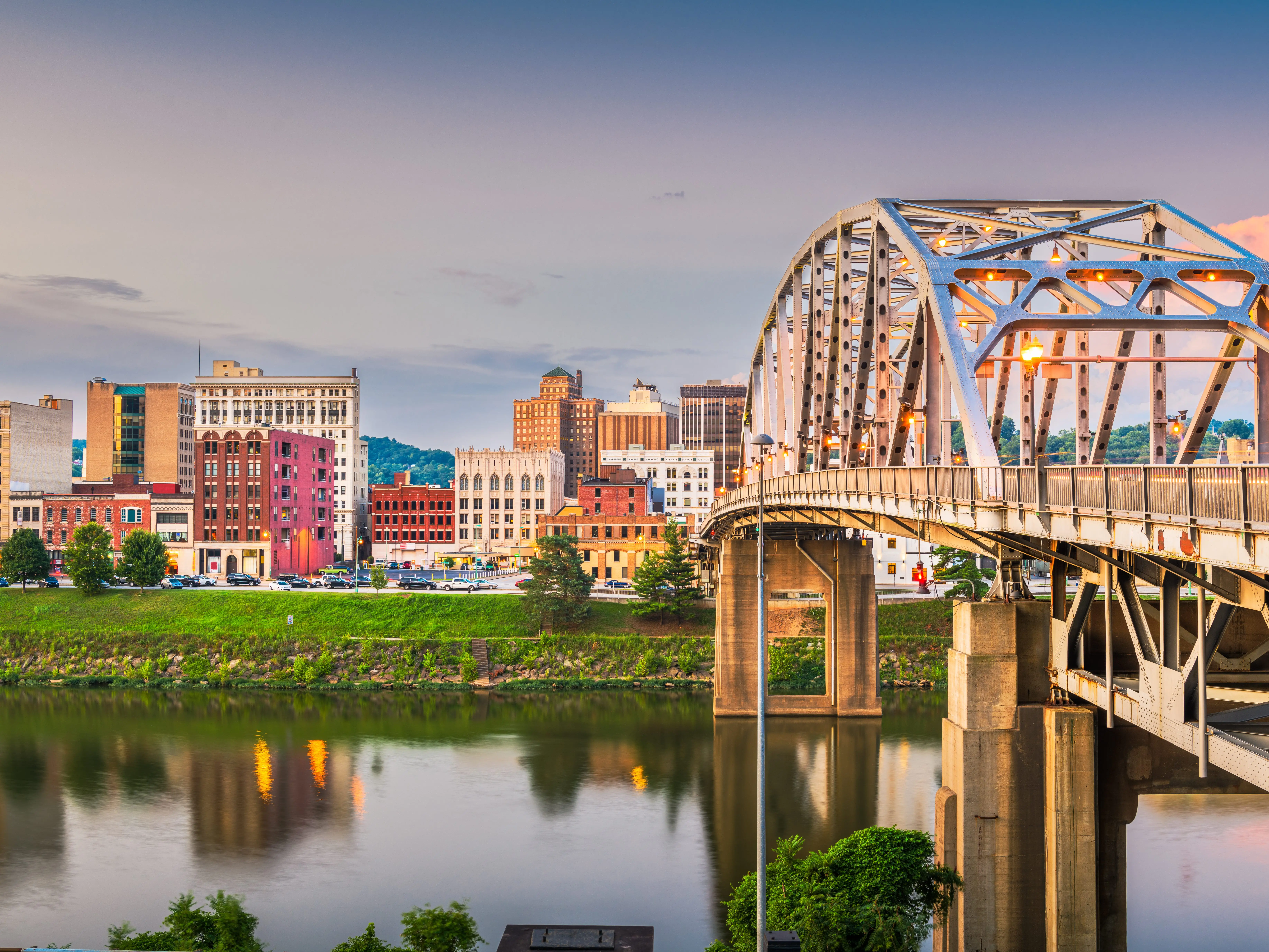 Charleston, West Virginia, USA downtown skyline on the river at dusk.