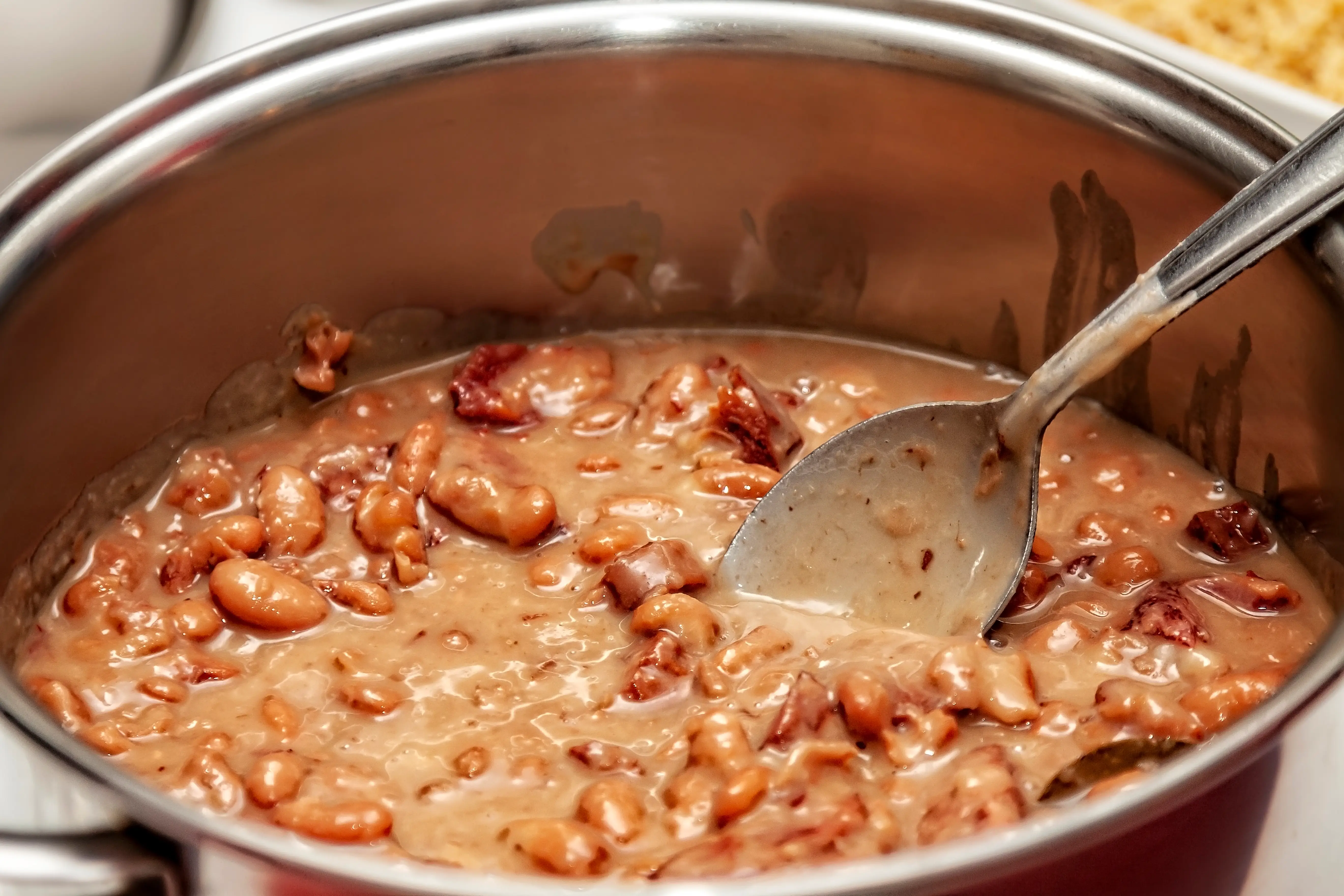 Spoon in pot of beans