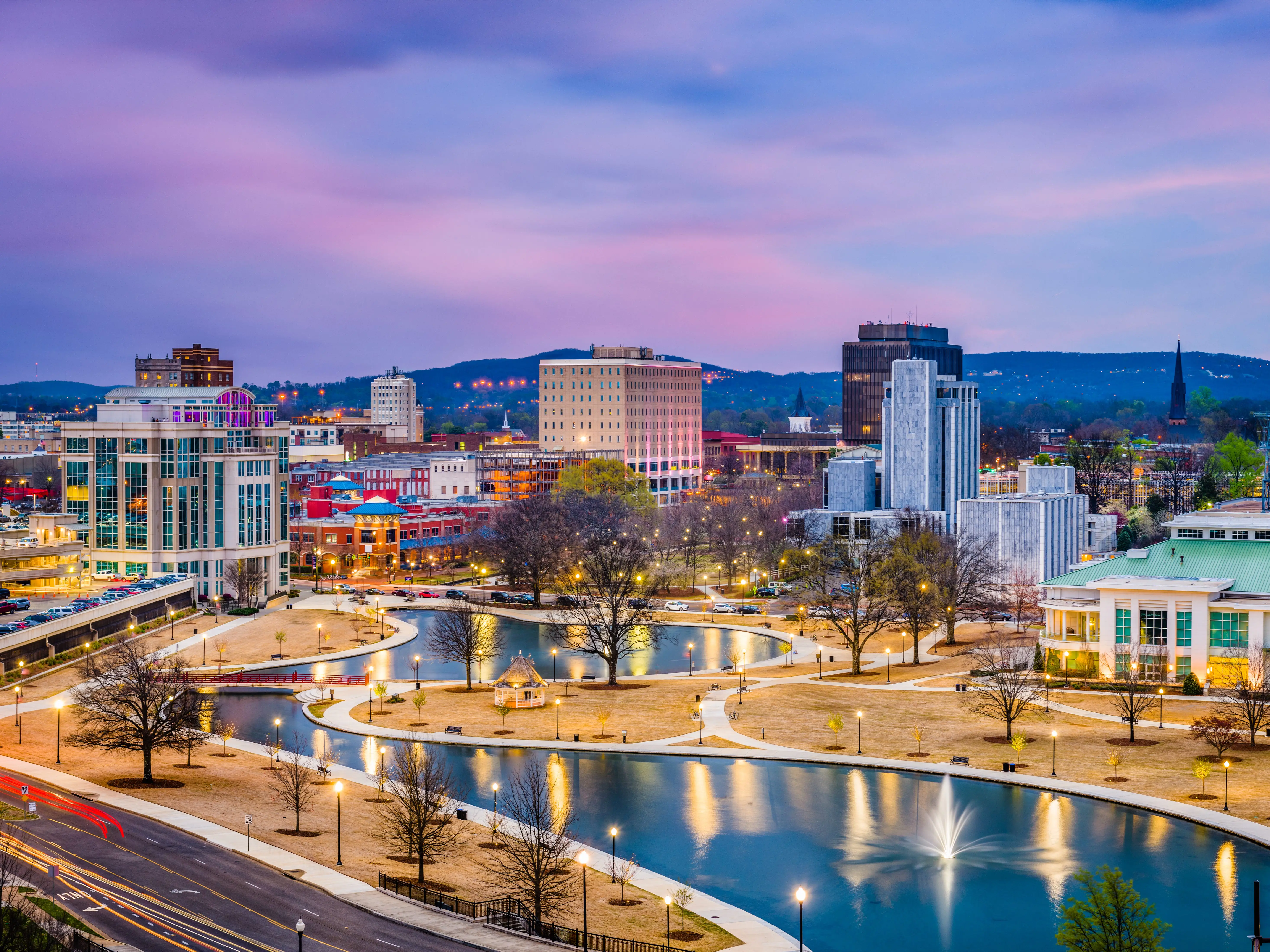 Huntsville, Alabama, USA park and downtown cityscape at twilight.