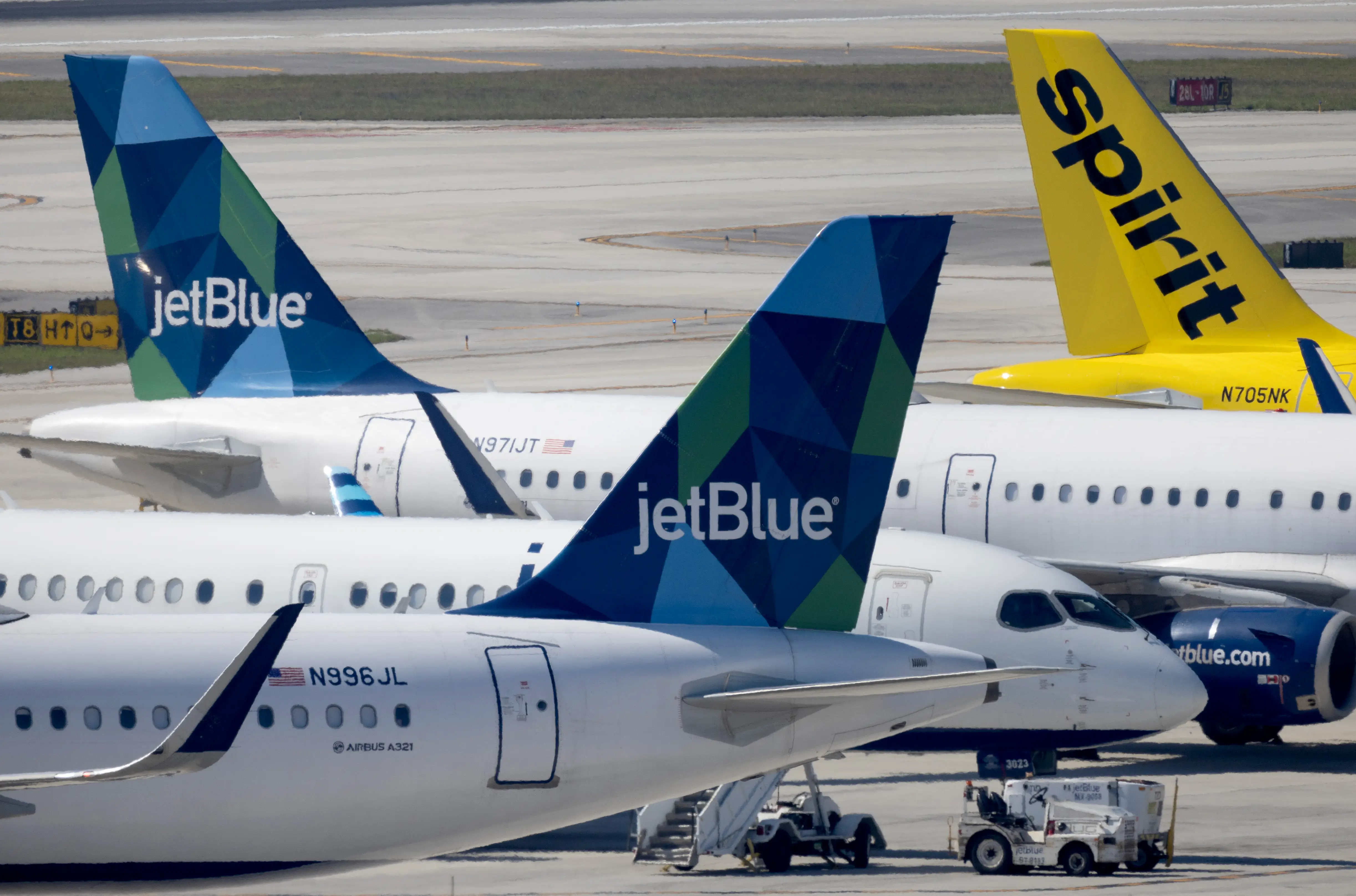 Jetblue airways planes and a spirit plane.