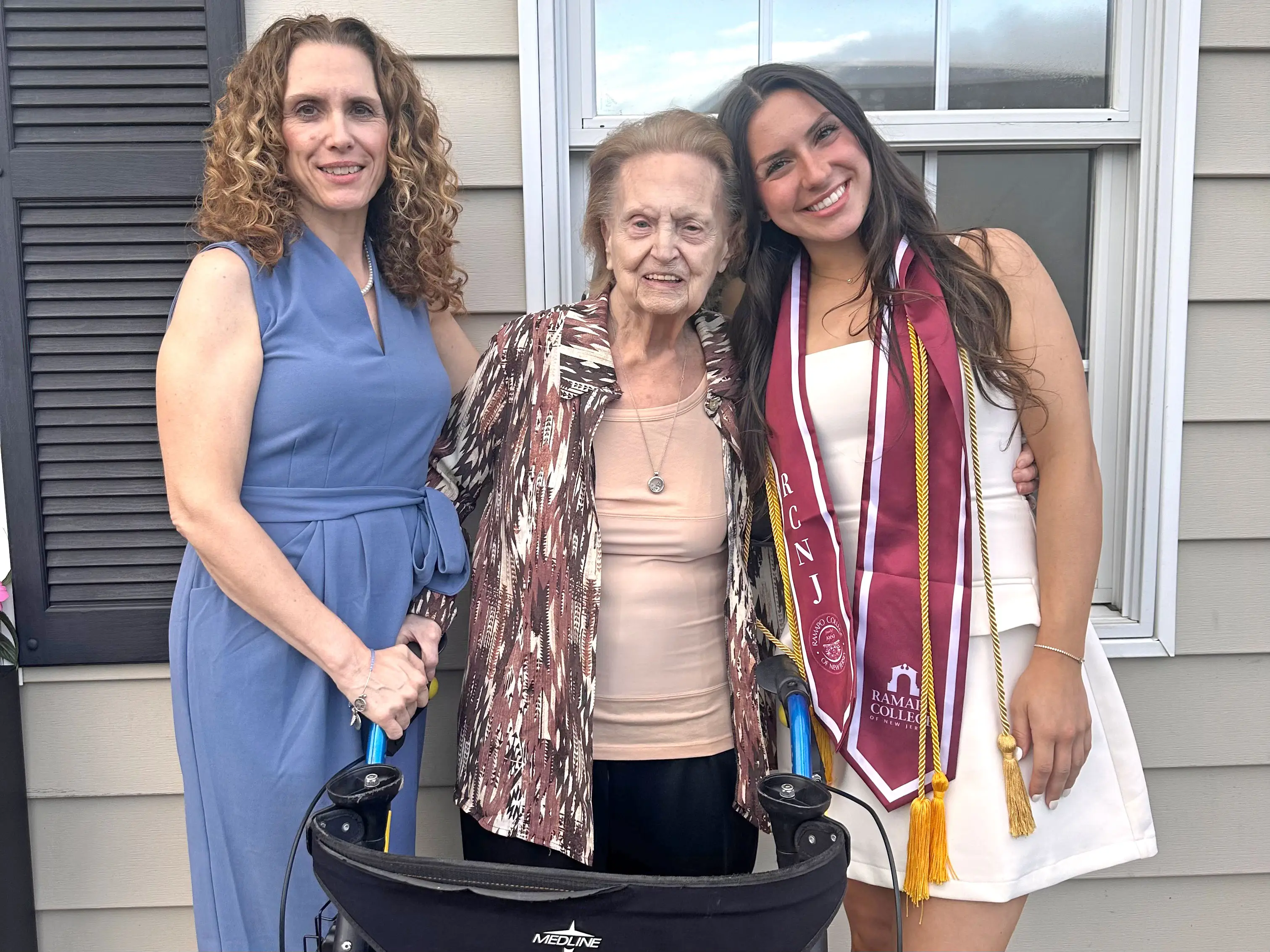 Amanda poses for a photo with her mom and grandmother.