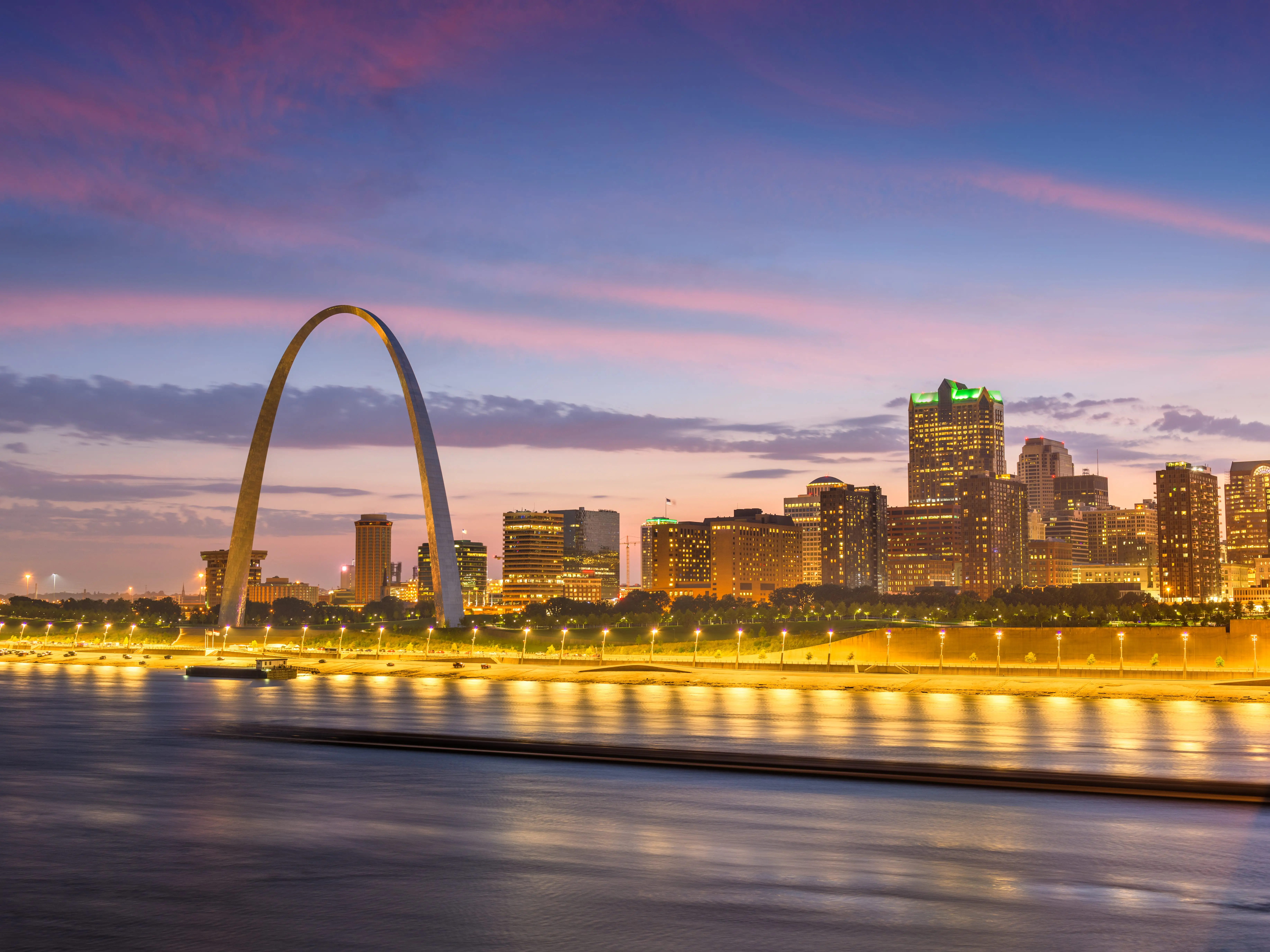 St. Louis, Missouri, USA downtown cityscape on the Mississippi River at twilight.