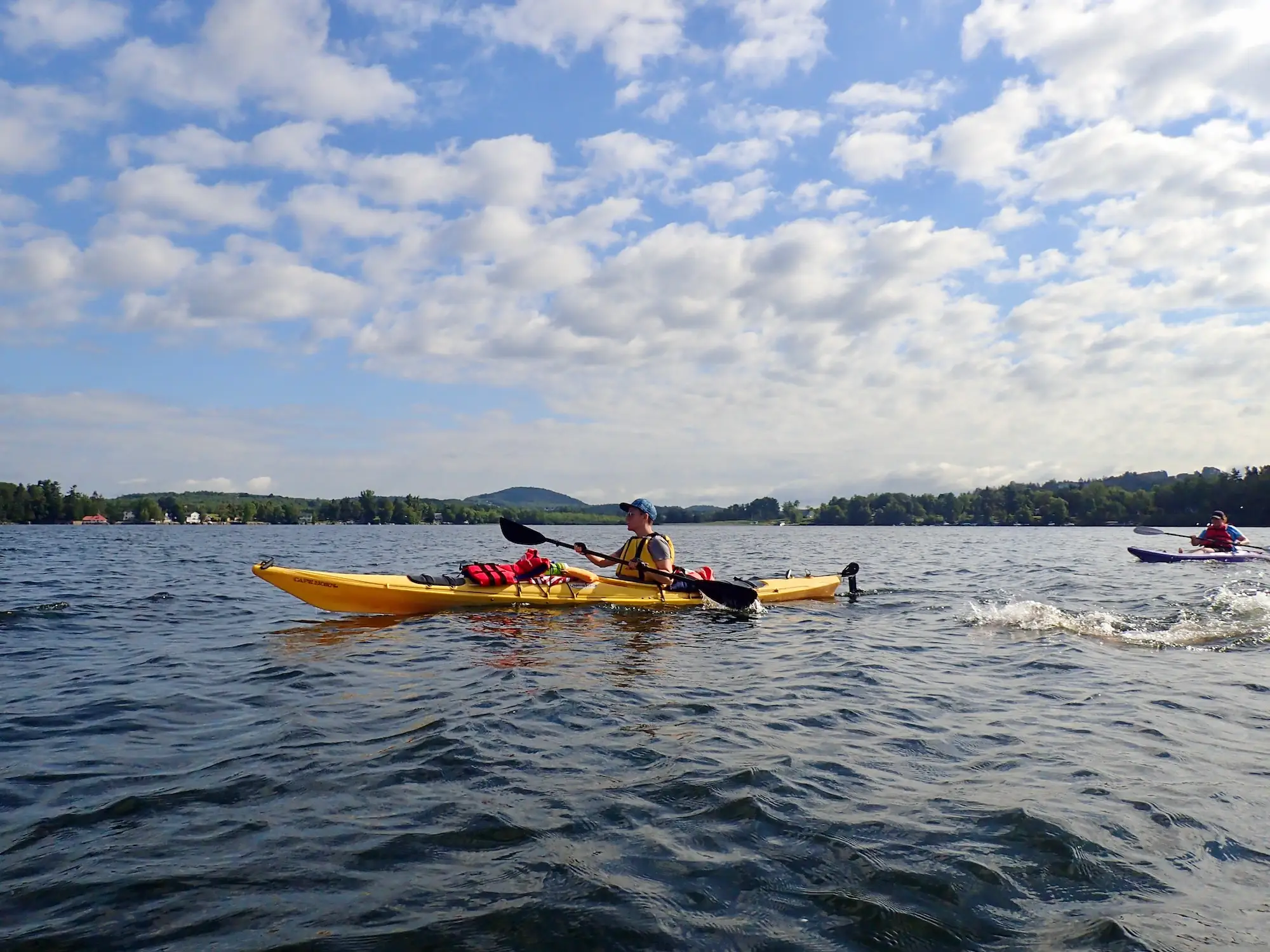 Lindsey paddles in a kayak.