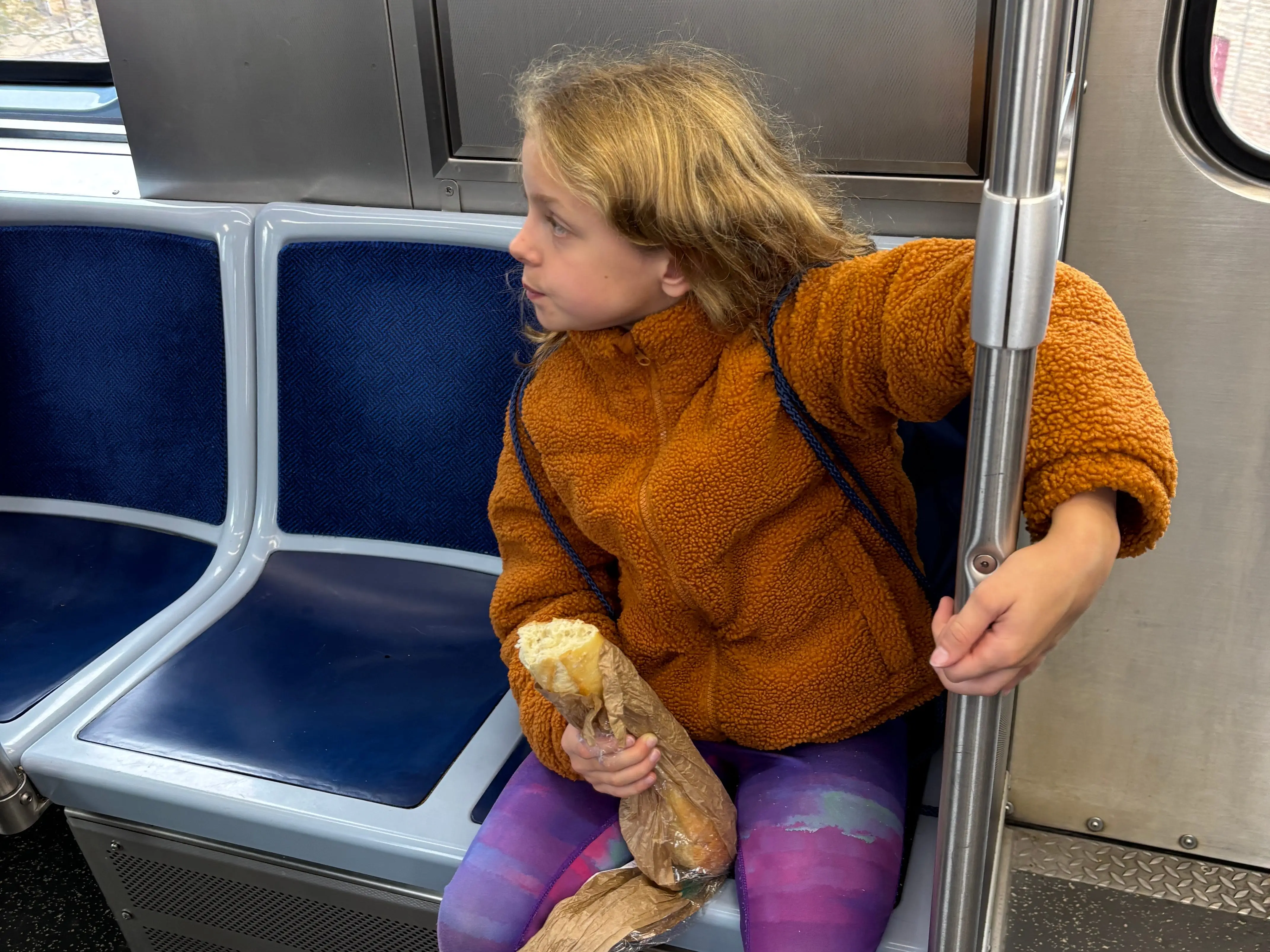 A young girl on the subway