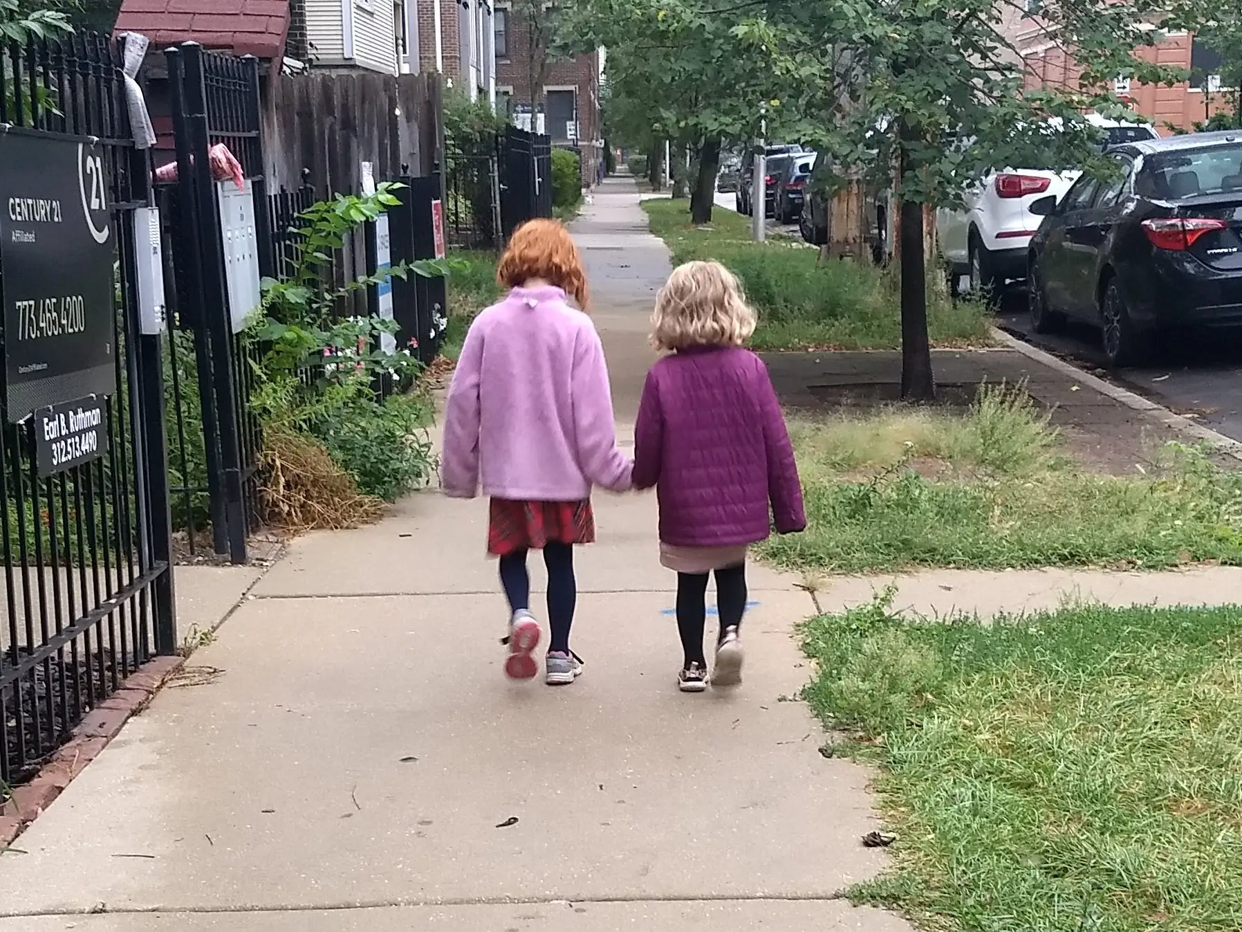 Two little girls walking.
